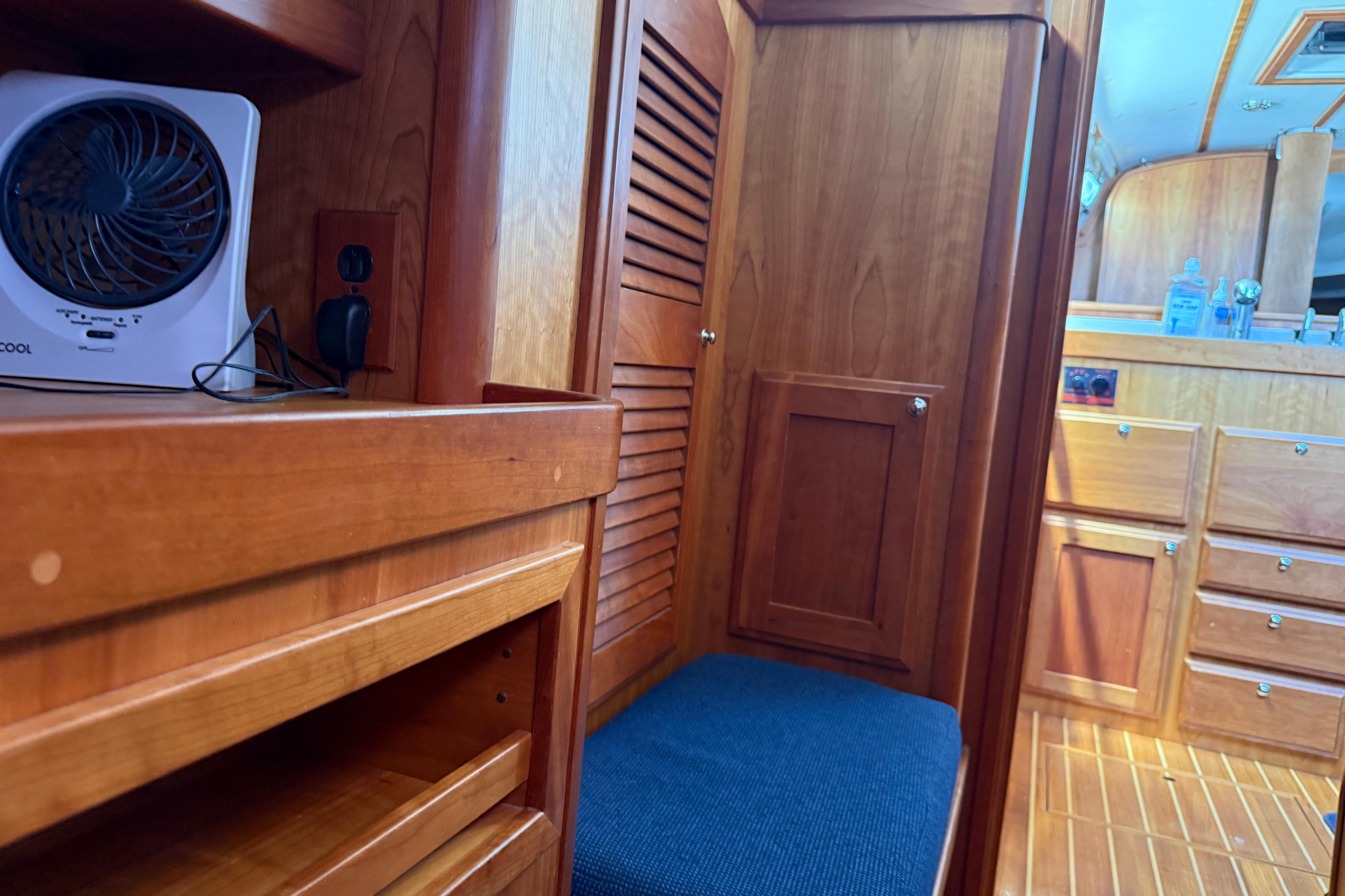 Interior of 2004 Sabre 386 yacht with wooden cabinetry and seating area.