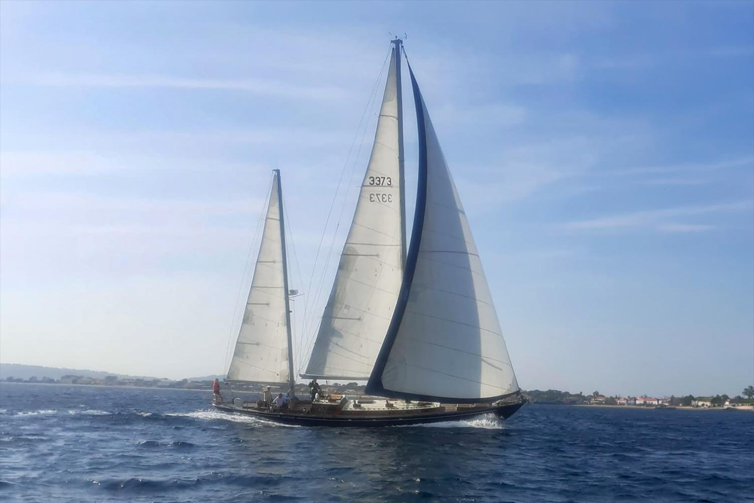 Vintage 1958 Costantini Yacht Classique sailing on open water.