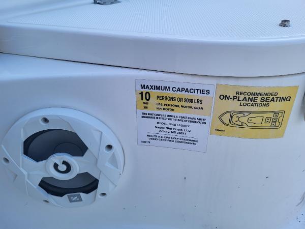 2021 NauticStar 2302 Legacy boat capacity label and speaker.
