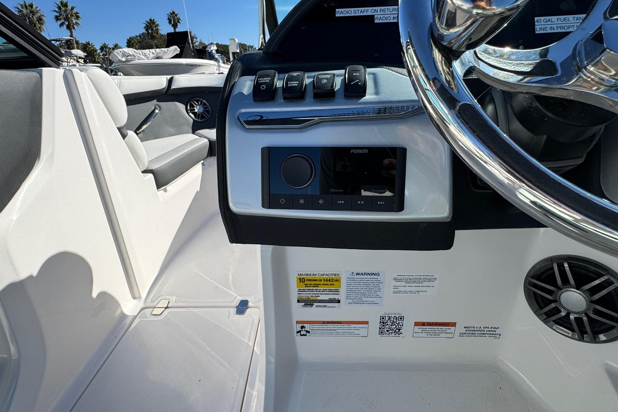 2026 Regal 21 OBX boat dashboard with controls and steering wheel.