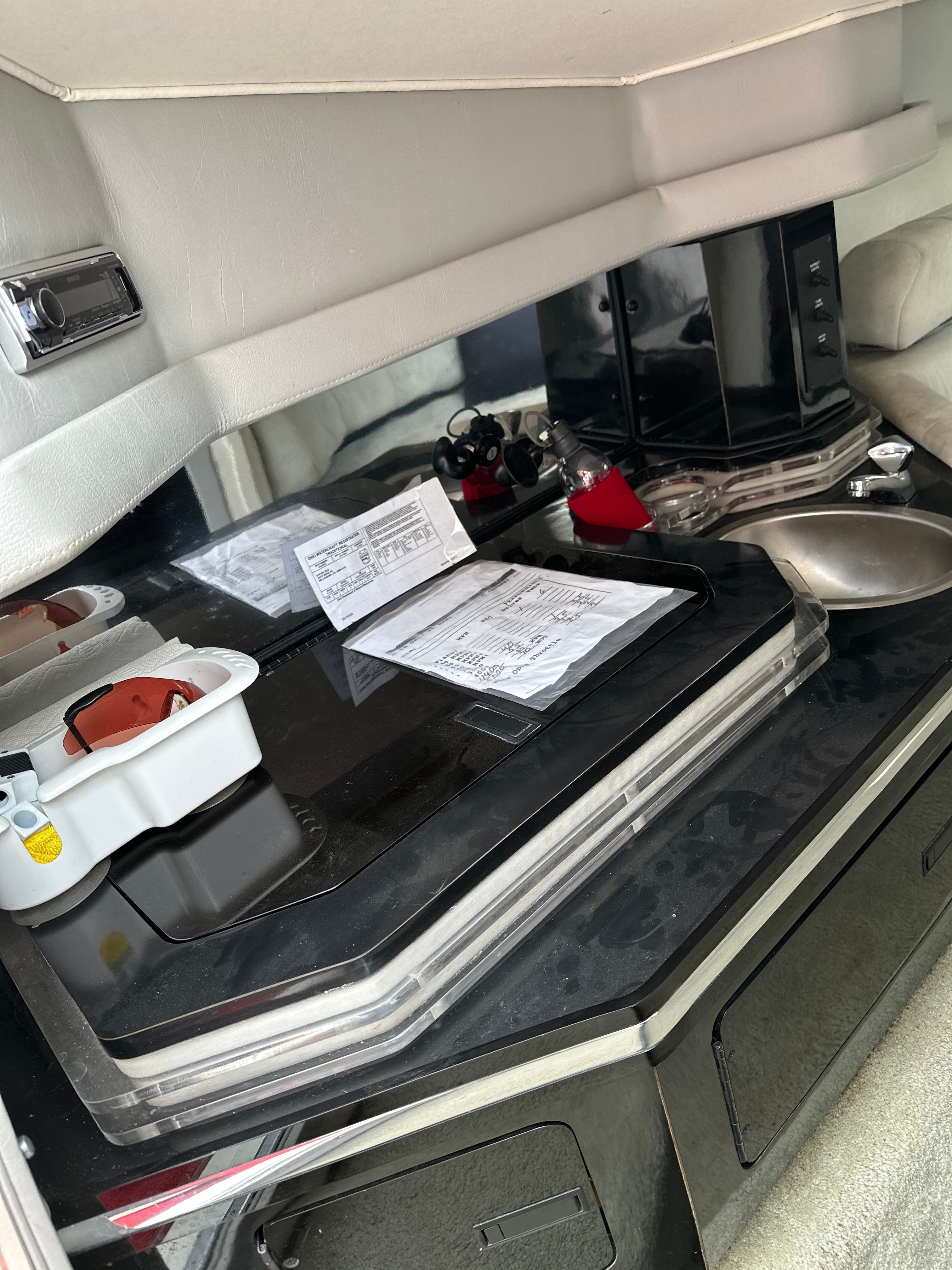 Interior of a 1994 Fountain EXECUTIONER with black countertop and sink.