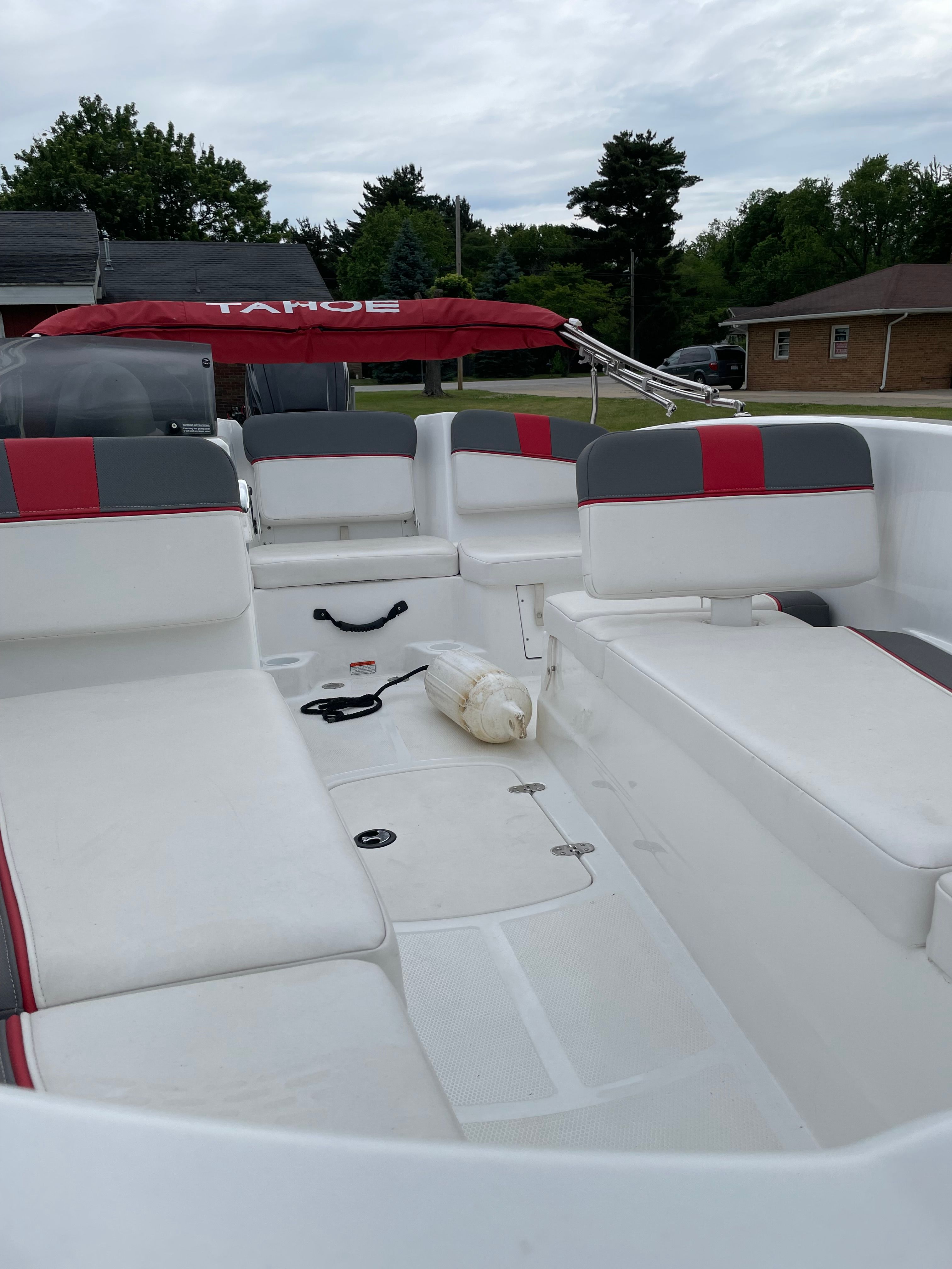 Interior of a 2022 Tahoe T16 boat with red accents.