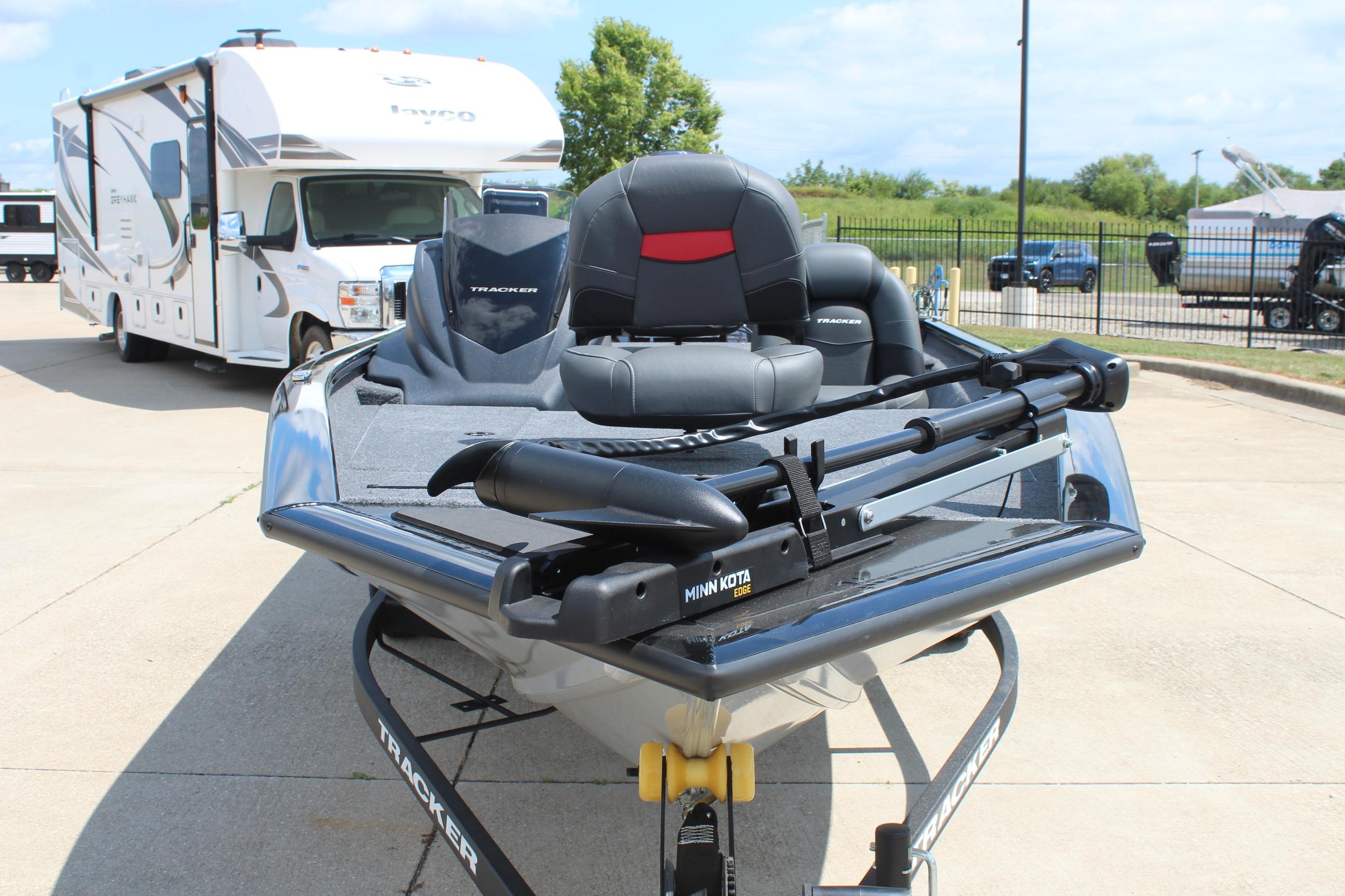 2026 Tracker Pro Team 175 boat with Minn Kota motor, parked near an RV.