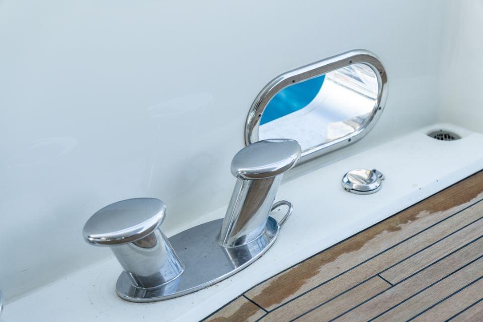 Close-up of cleats and porthole on 2009 Sunseeker 34 Metre Yacht deck.