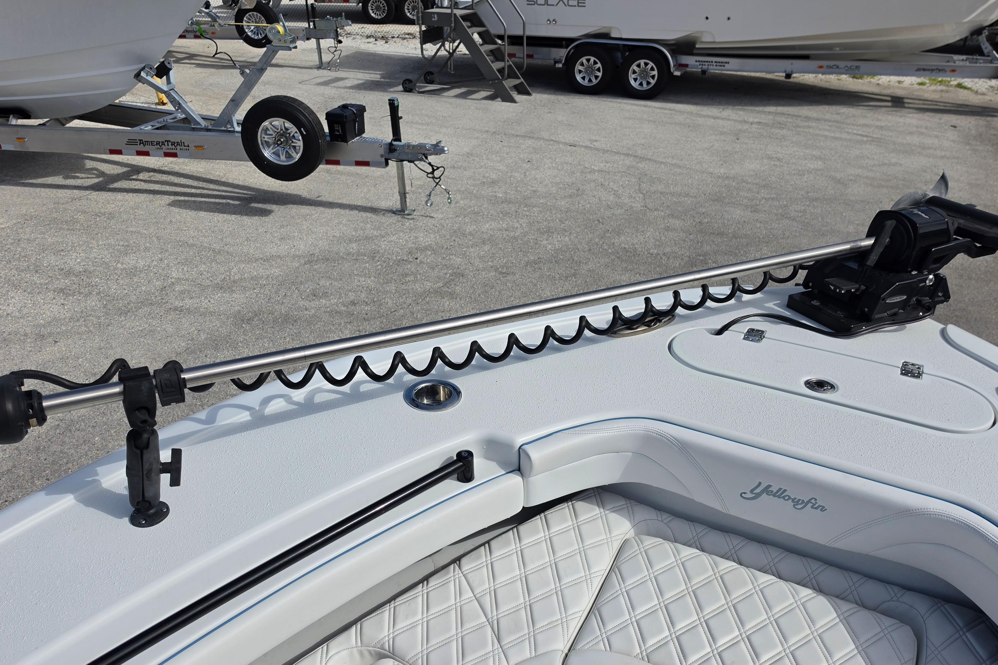 2025 Yellowfin 26 Hybrid boat with trolling motor and quilted seating detail.