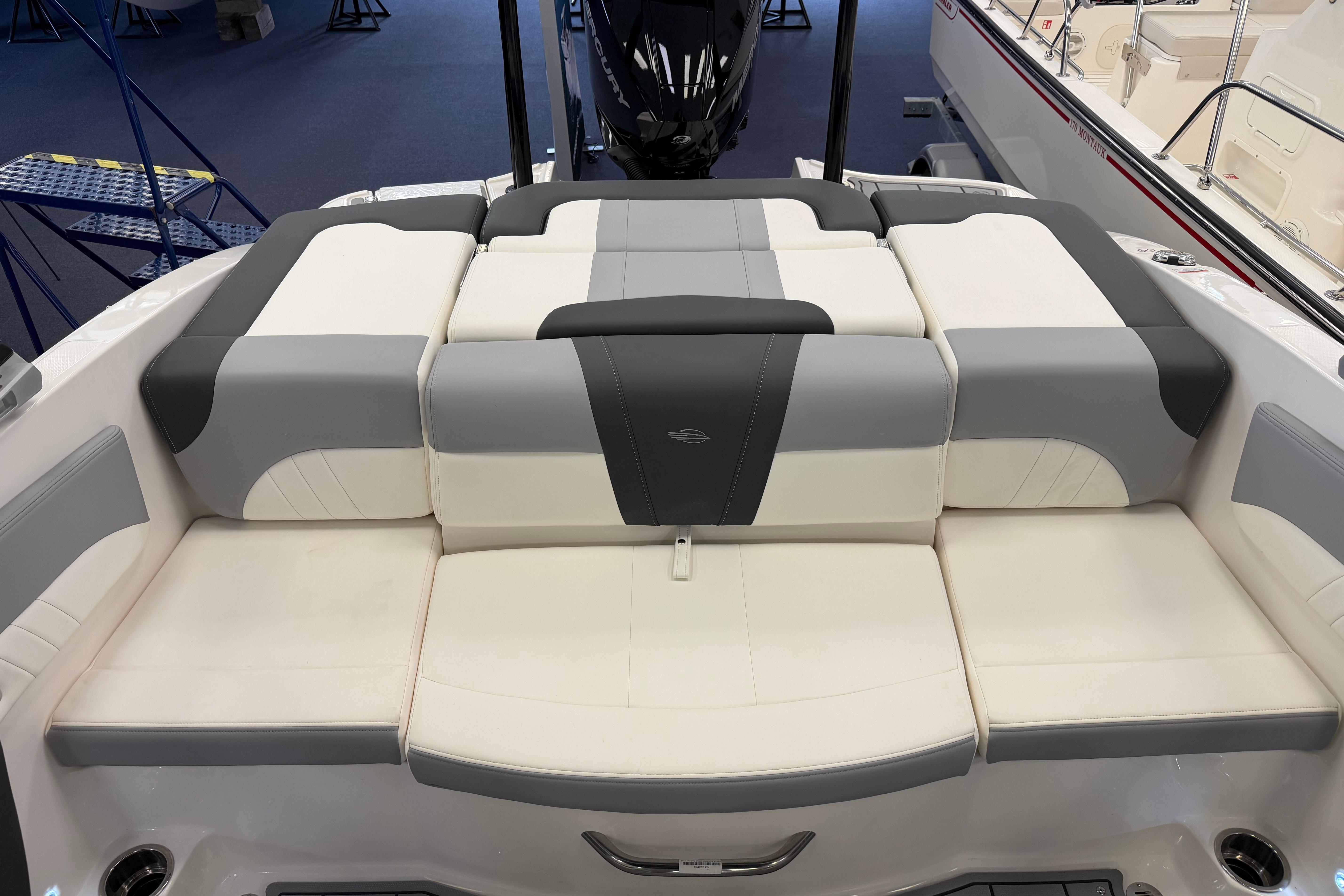2025 Chaparral 21 SSi OB boat interior with cushioned seating and modern design.