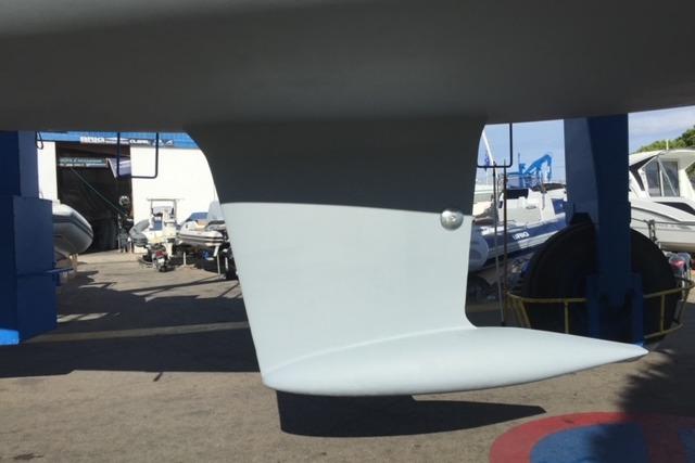 Keel of 2013 Dufour 380 sailboat in a boatyard setting.