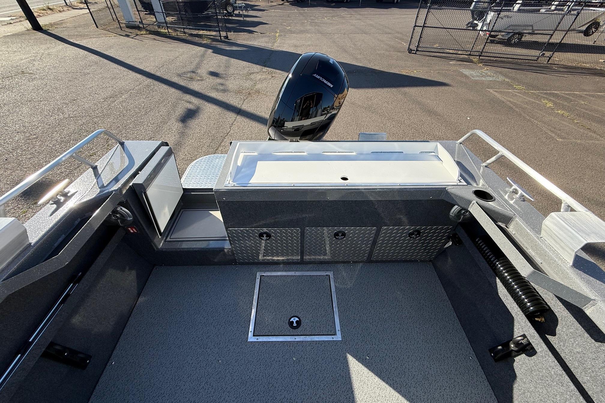 2026 Thunder Jet 185 Luxor boat interior with storage compartments and motor.