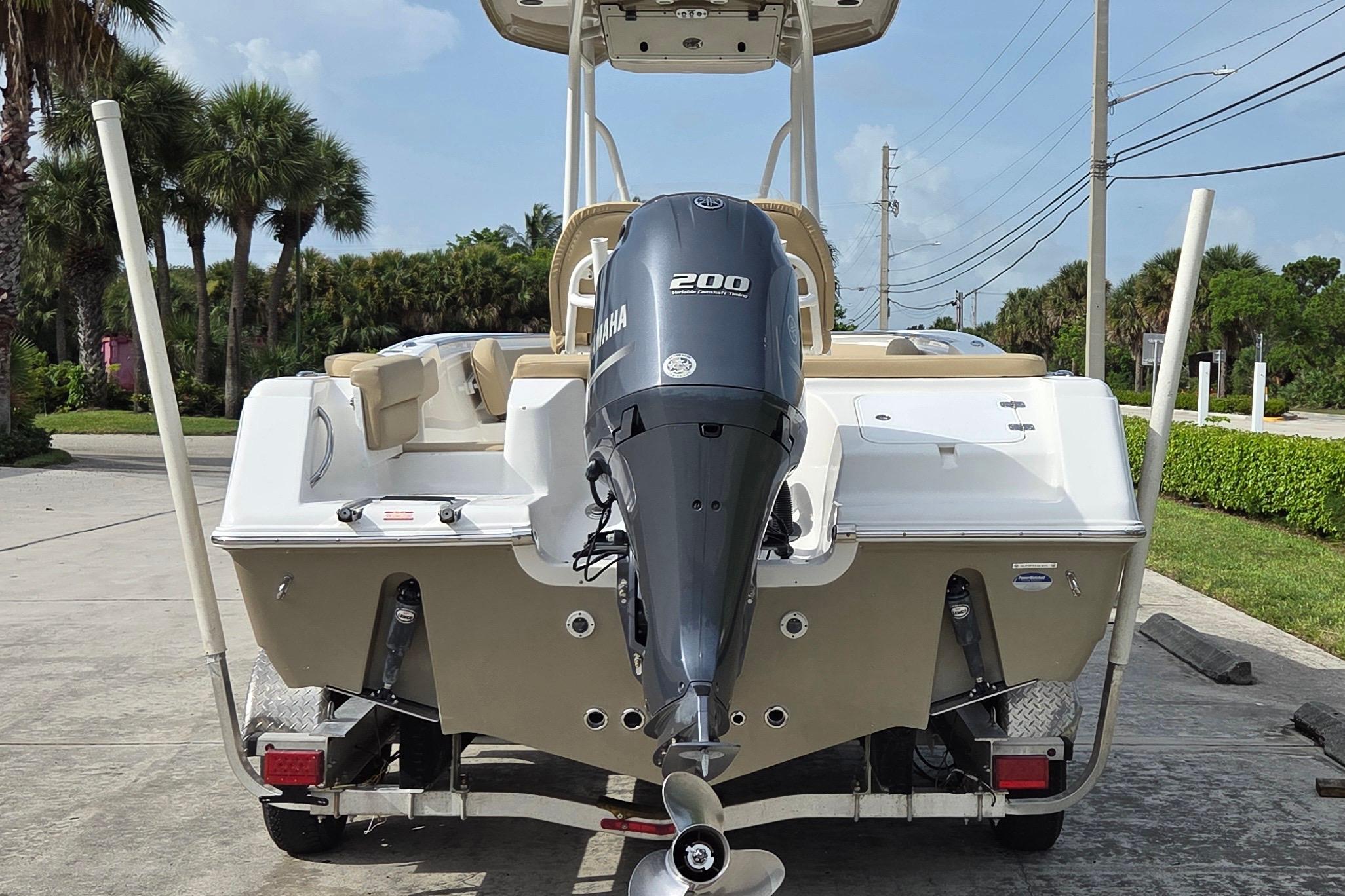 2015 Tidewater 220 LXF boat with Yamaha 200 engine, parked on a trailer.