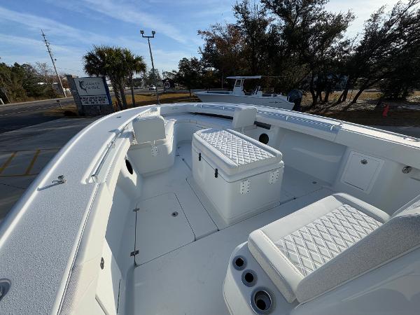 2025 Yellowfin 39 Offshore boat interior with white seating and storage compartments.