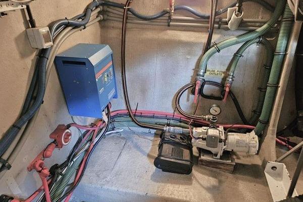 Engine room of 2005 Sunseeker Manhattan 66 yacht with electrical and plumbing systems.