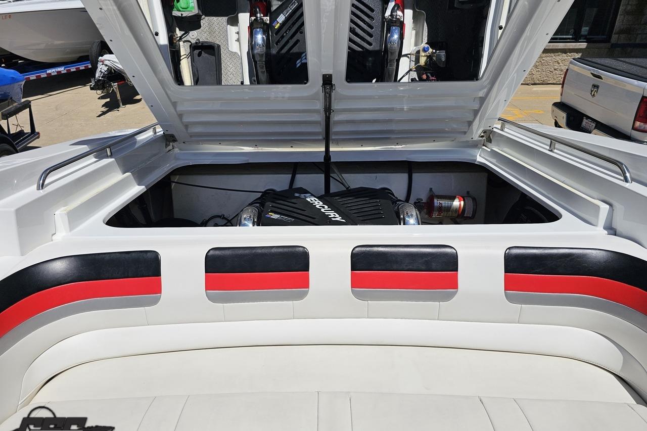 Open engine compartment of a 2005 Formula 271 FASTech boat, showcasing Mercury engine.