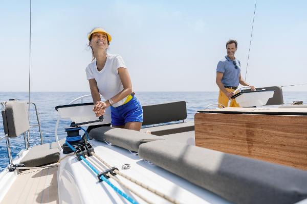 2024 Dufour 41 sailboat with two people enjoying the open sea.