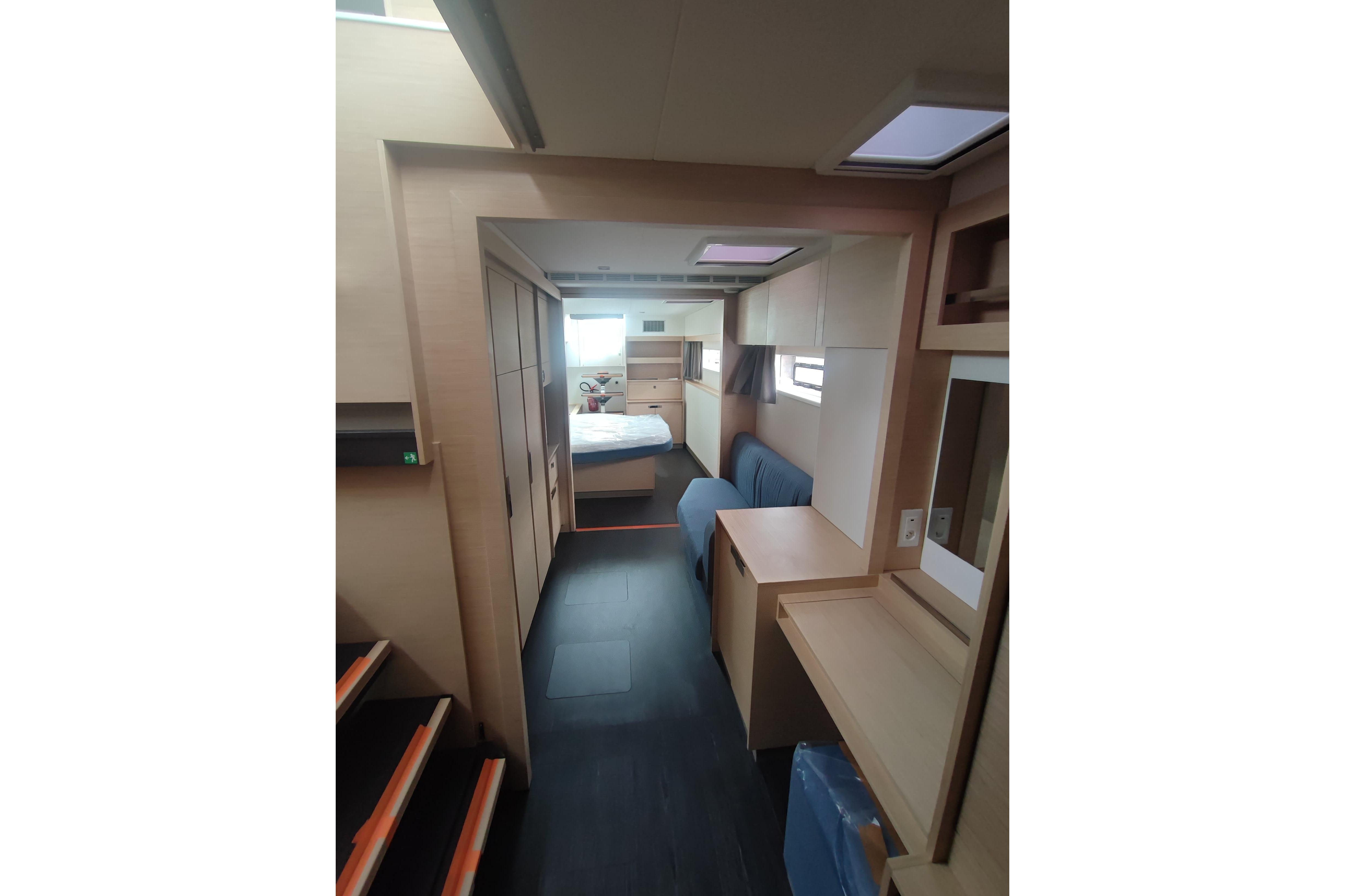 Interior of 2025 Fountaine Pajot Aura 51 Catamaran, featuring modern design and cozy furnishings.
