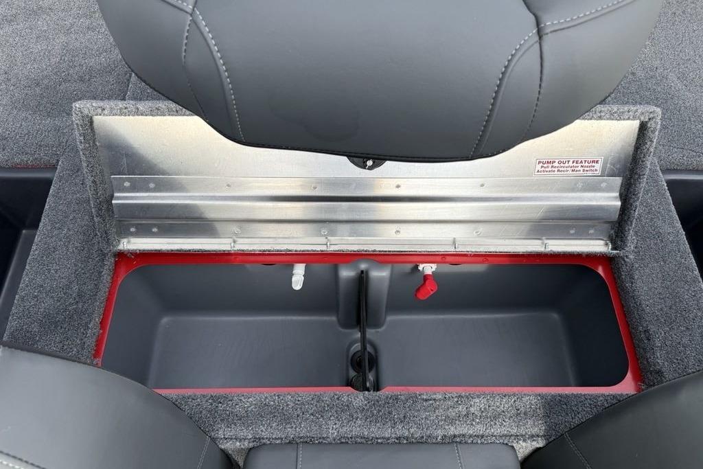 Open storage compartment in 2026 Tracker Pro Team 175 boat, featuring pump-out feature.