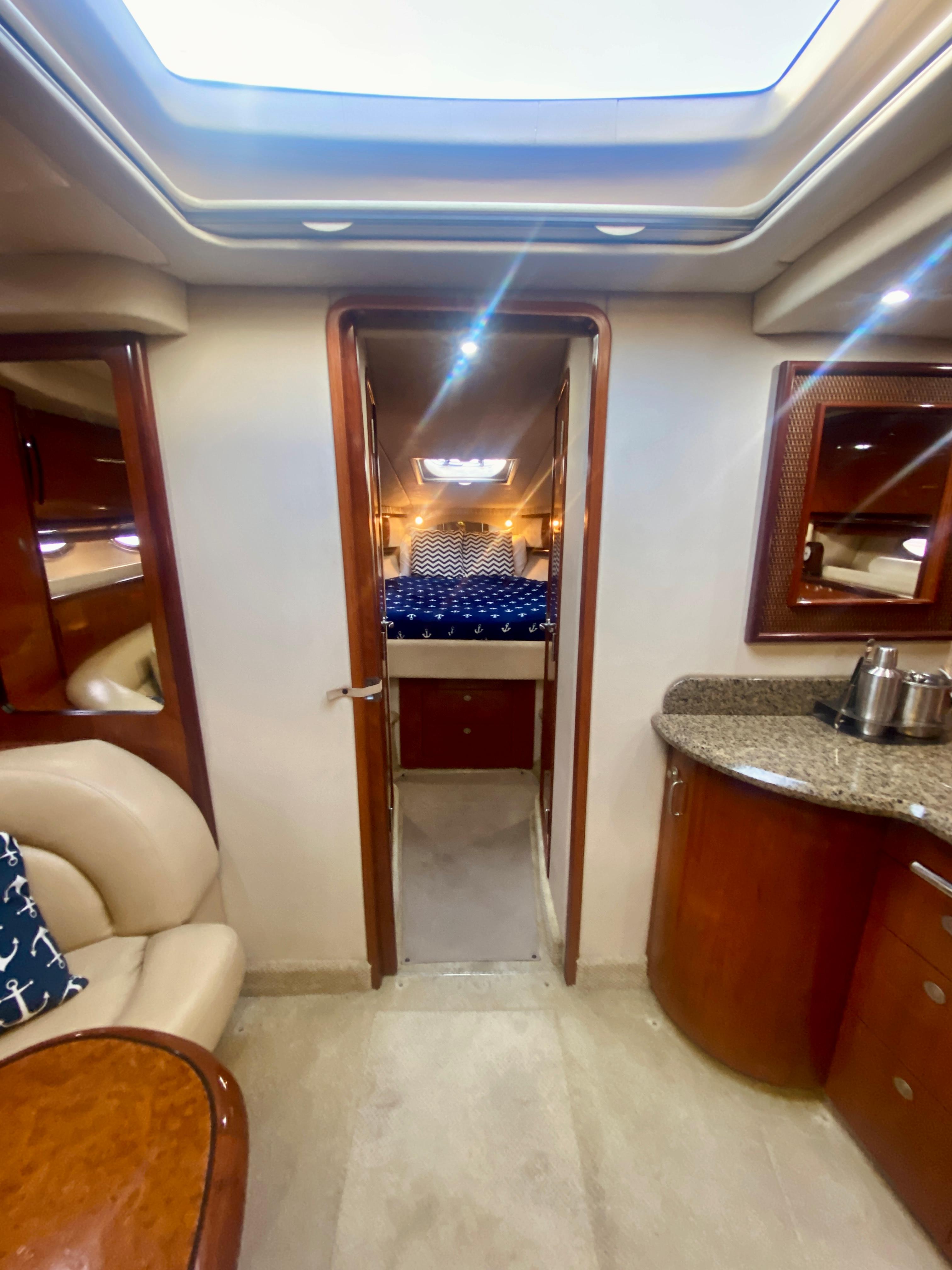Interior of 2005 Sea Ray 420 Sundancer yacht with cozy cabin and modern amenities.