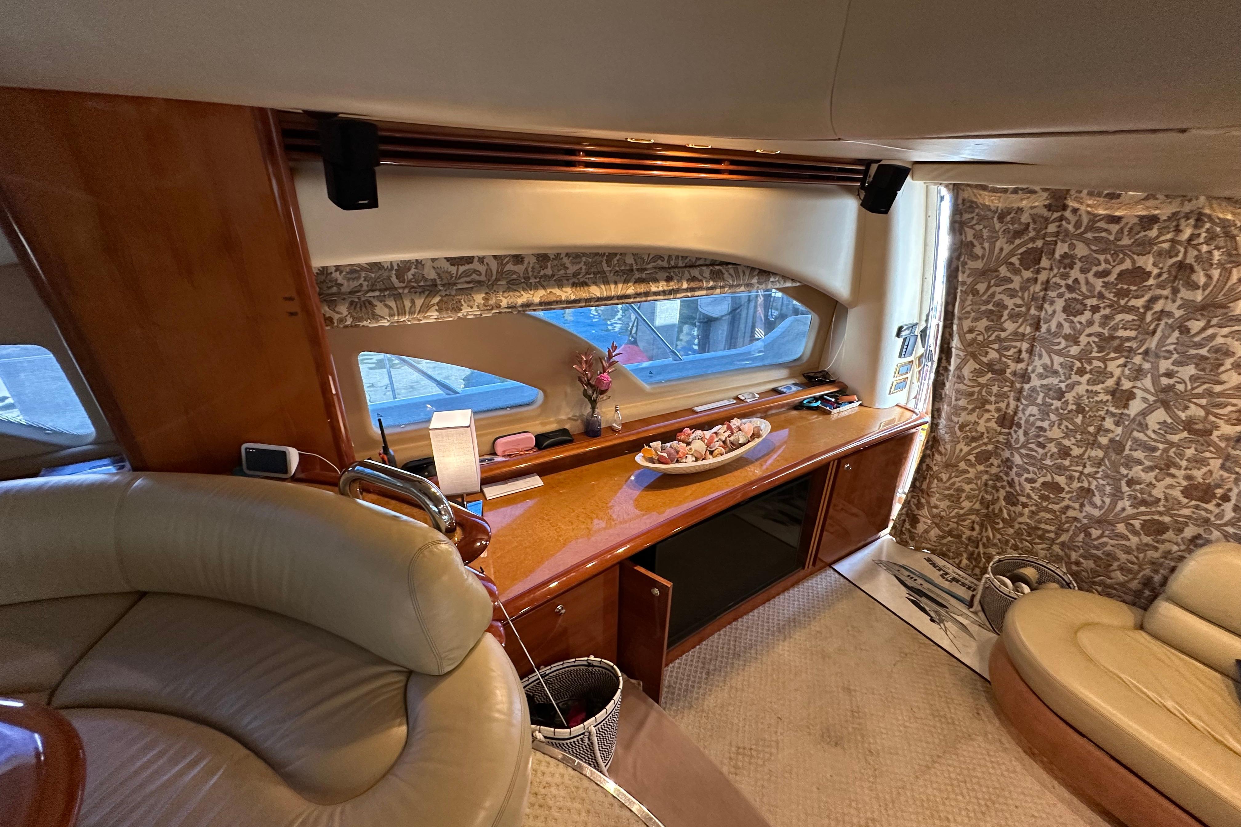 Luxurious interior of a 2004 Azimut 55E yacht with elegant furnishings and decor.