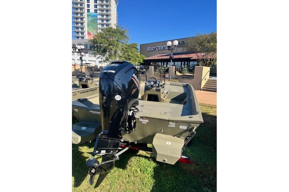 2026 Tracker Grizzly 2072 CC boat displayed outdoors near a boat center.