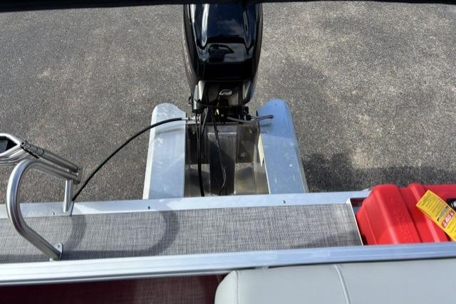 2026 Sun Tracker Party Barge 16 DLX pontoon boat with motor and fuel container.
