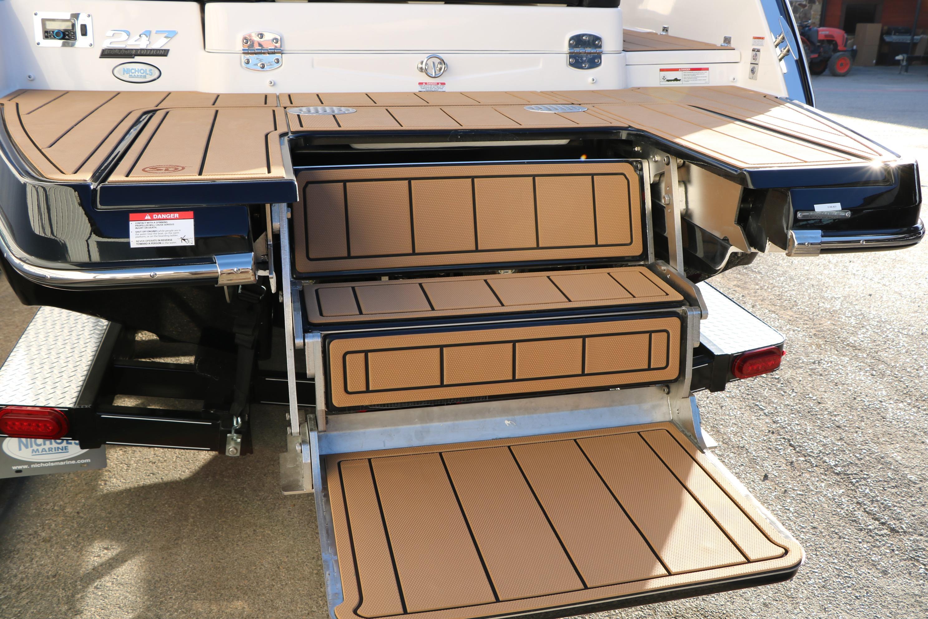 2026 Chaparral 247 SSX boat with extended swim platform and integrated steps.