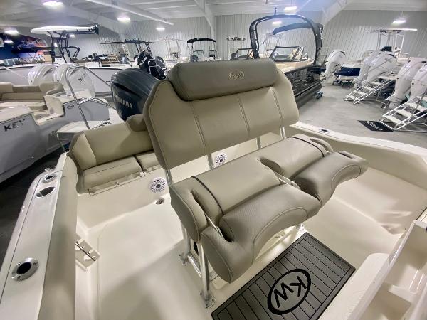 2024 Key West 219 FS boat interior with cushioned seating and Yamaha engine.