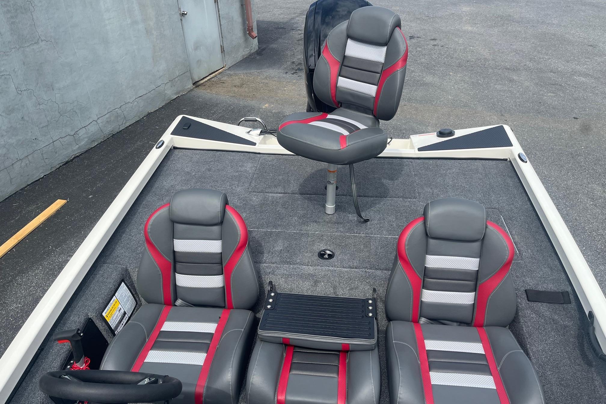 2025 Ranger RT178 boat interior with gray and red seating, featuring a swivel chair.