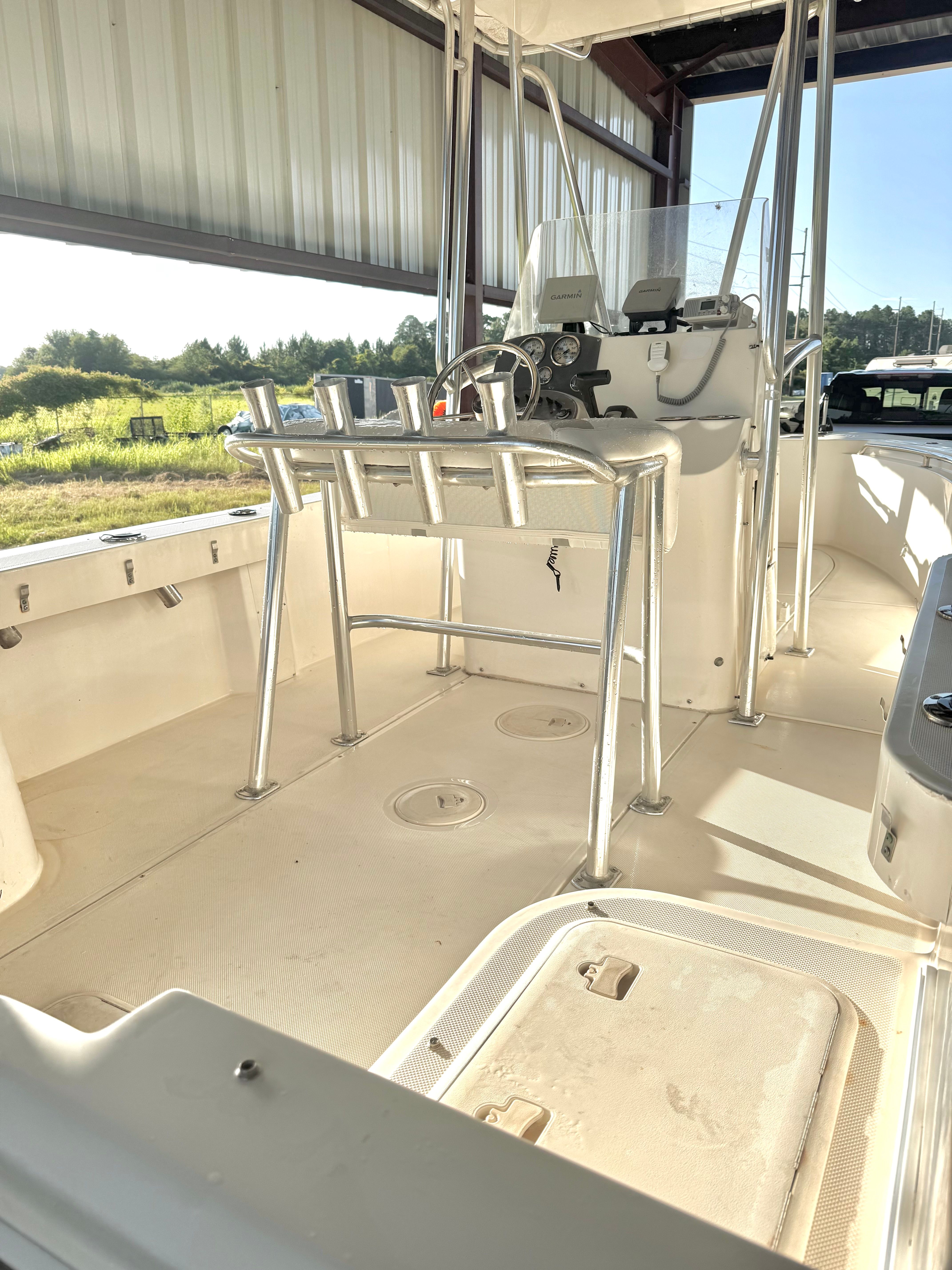 The image shows the deck of a 2007 McKee Craft Marathon 196 CC boat in a warehouse.