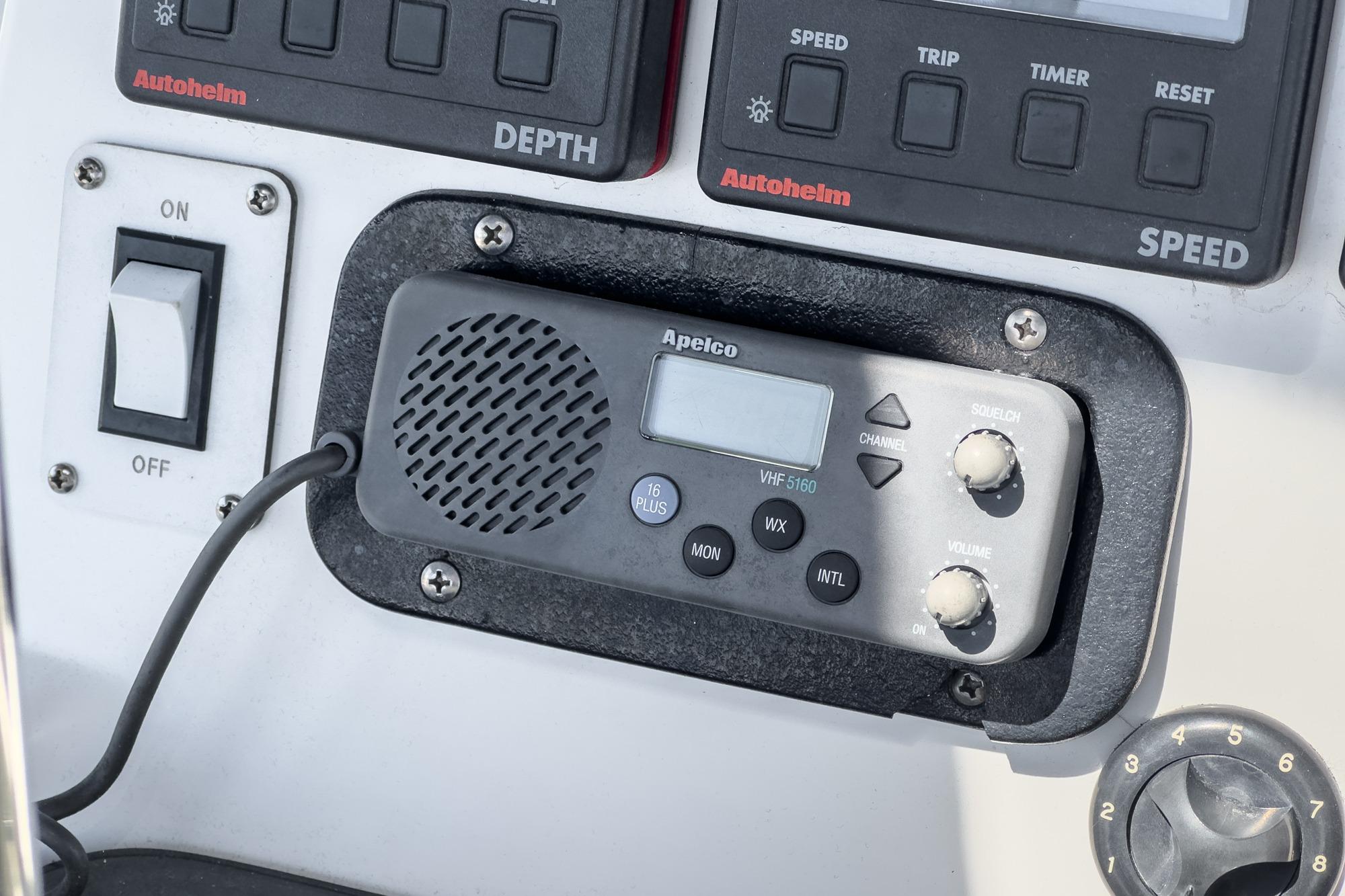 Control panel of a 1996 Hunter 376 sailboat with Apelco VHF radio.