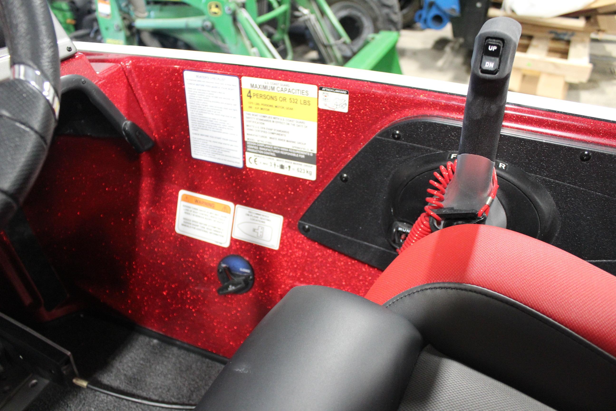 2026 Nitro Z19 XL Pro boat interior with red accents and control panel.