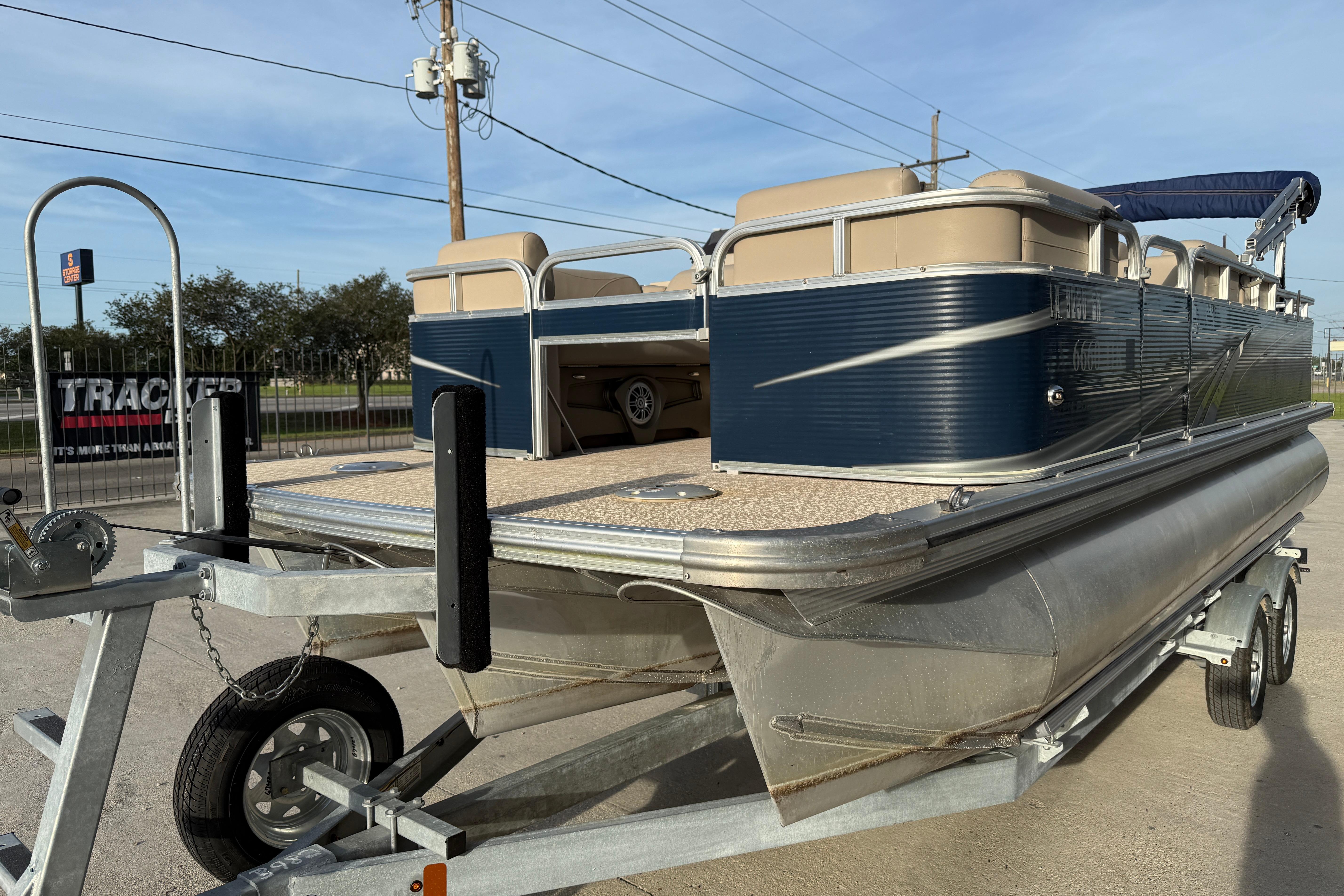 2019 Avalon Venture Fish N Cruise 20' pontoon boat on trailer, parked outdoors.