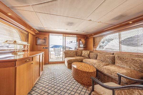 Luxurious interior of 2001 Grand Harbour 76 yacht with plush seating and elegant decor.