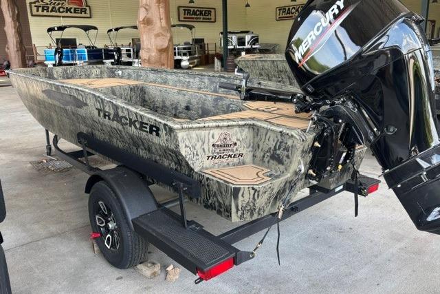 2026 Tracker Grizzly 1650 T Prairie Wings Edition boat with Mercury engine on trailer.