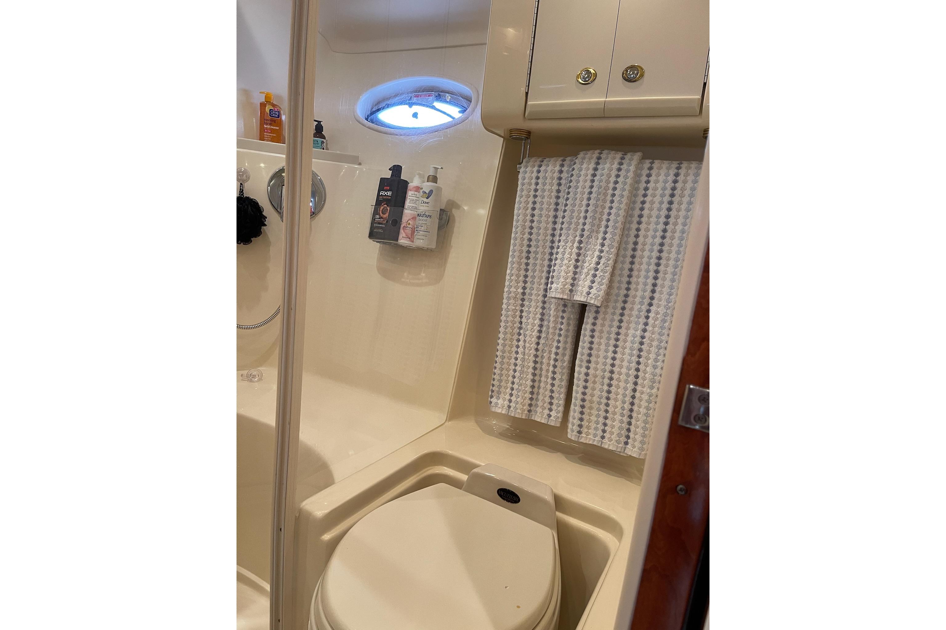 Bathroom interior of 2003 Sea Ray 550 Sundancer yacht, featuring shower and toilet.