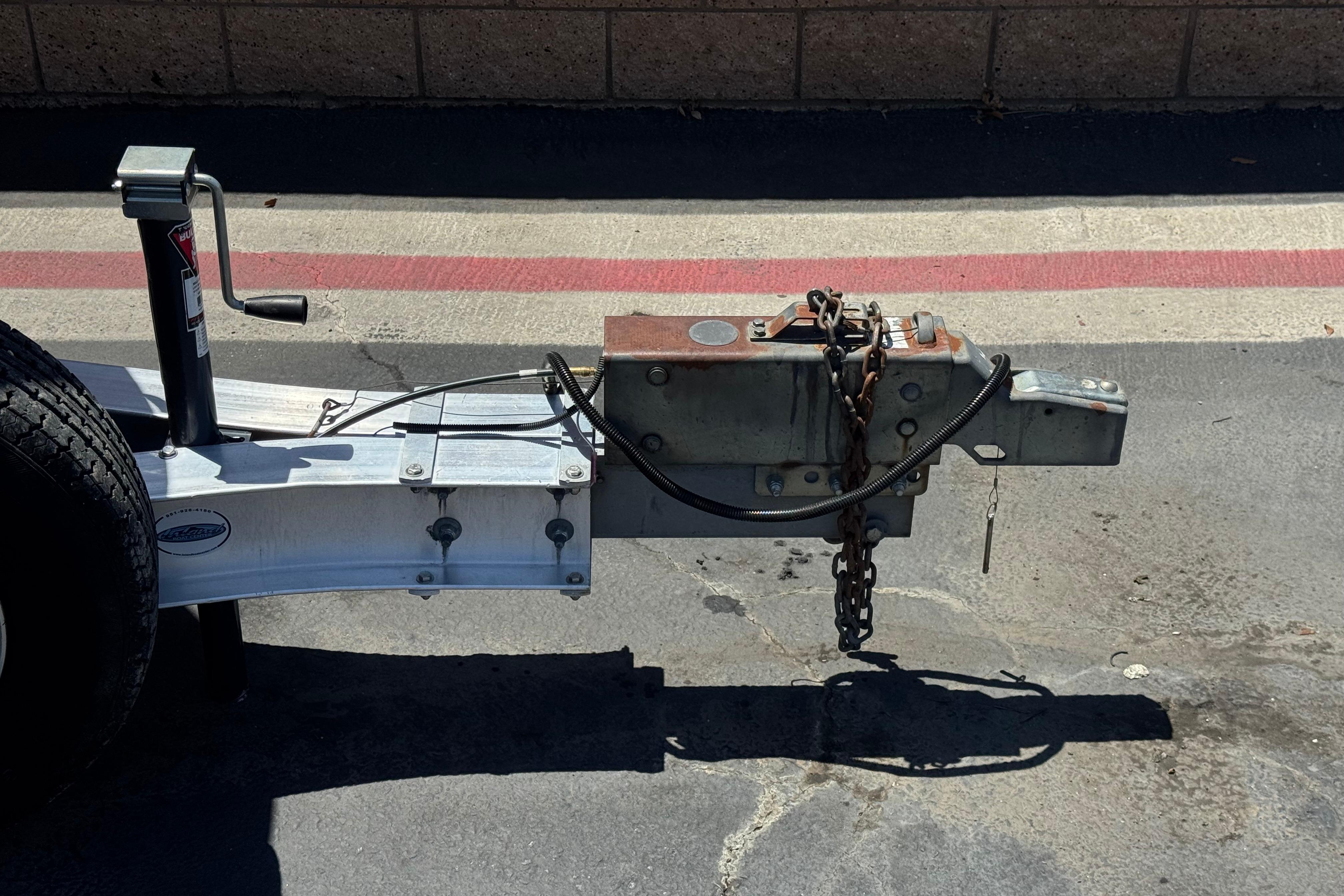 Trailer hitch for 2007 Sea Ray 240 Sundeck, parked on asphalt.