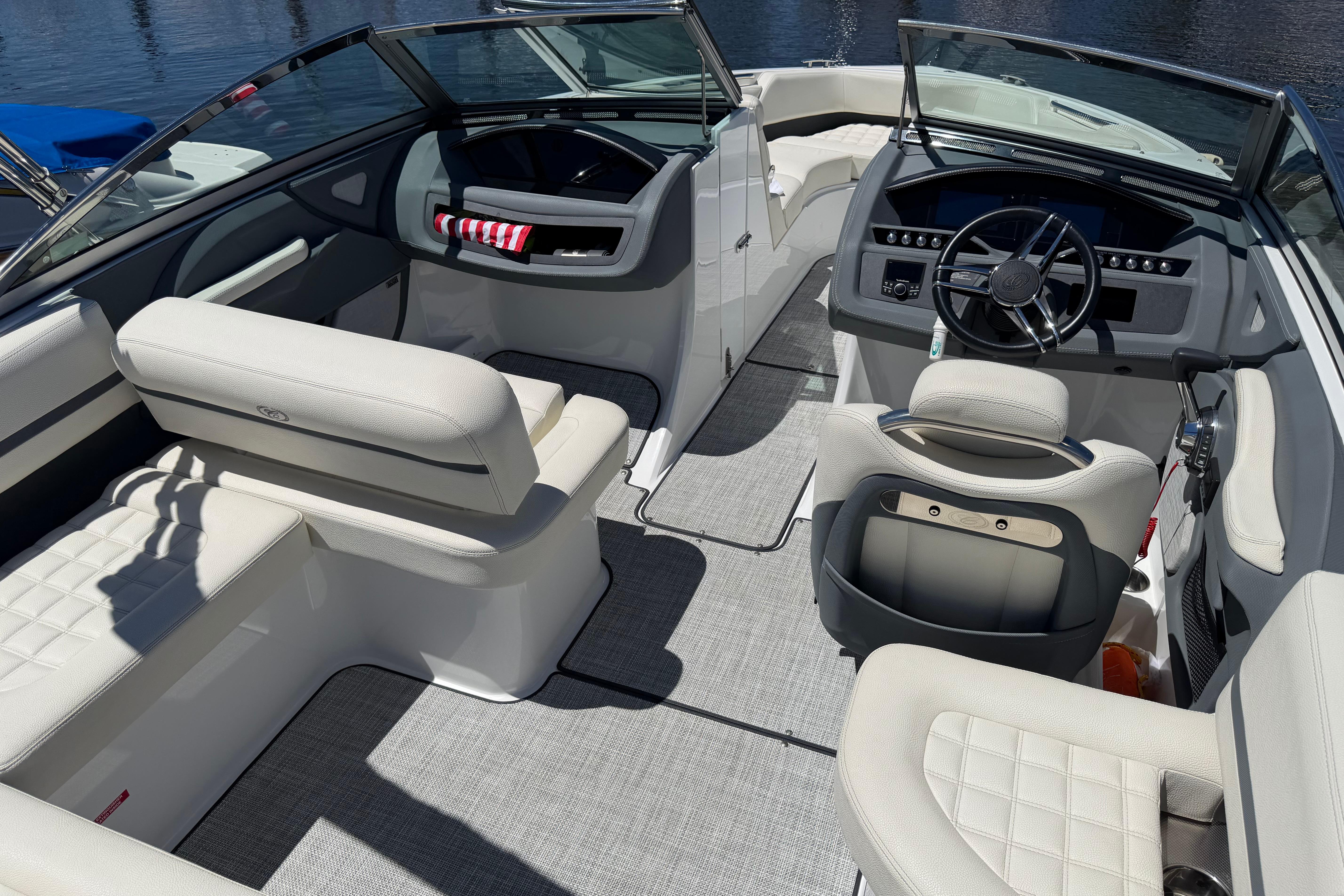 Interior of a 2020 Cobalt R3 boat with luxurious seating and modern dashboard.
