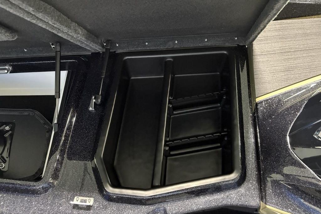 2026 Skeeter ZXE21 boat storage compartment with open lid and organized interior.
