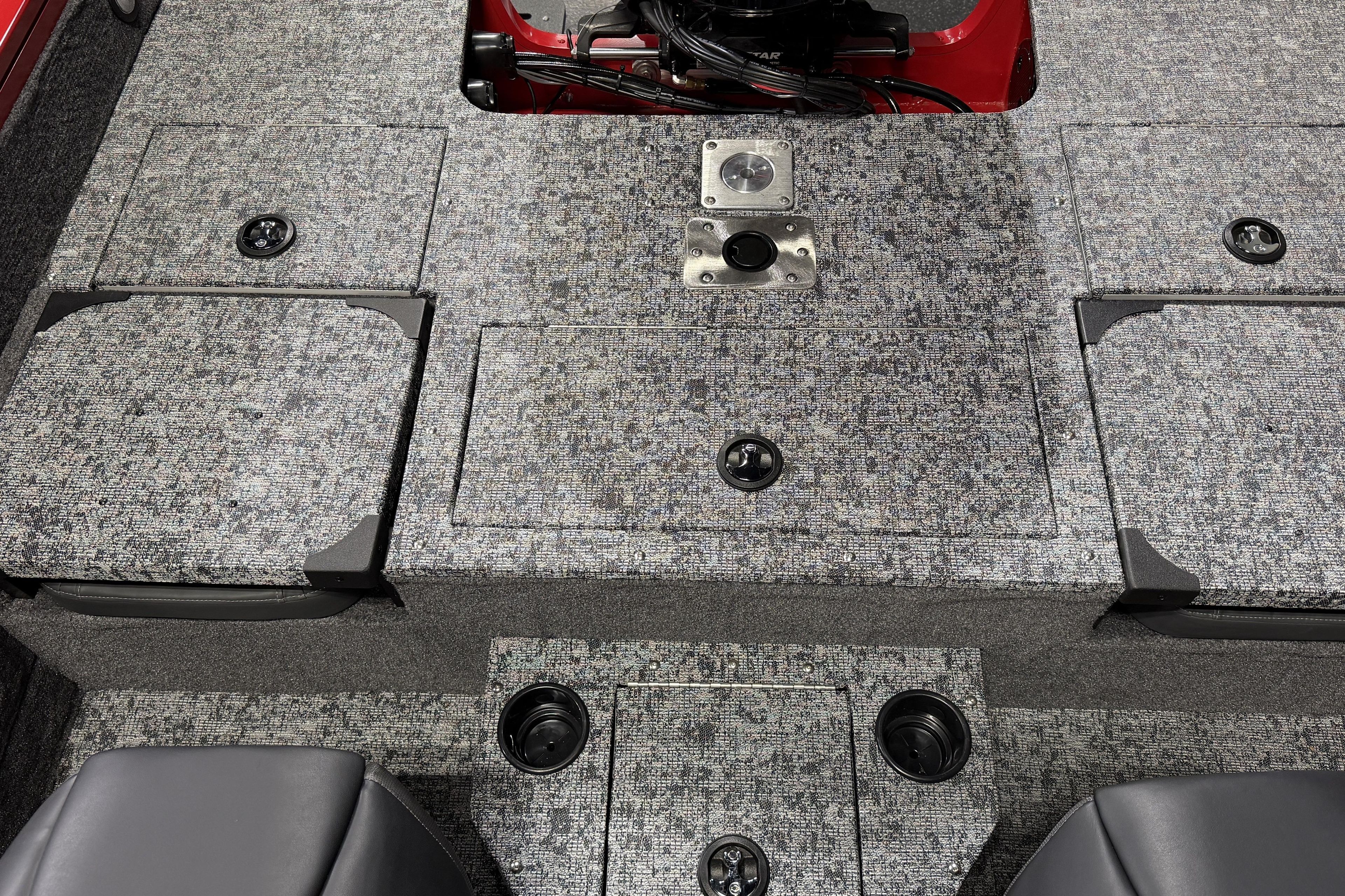 2026 Tracker Targa V-18 Combo boat interior with gray textured flooring and storage compartments.