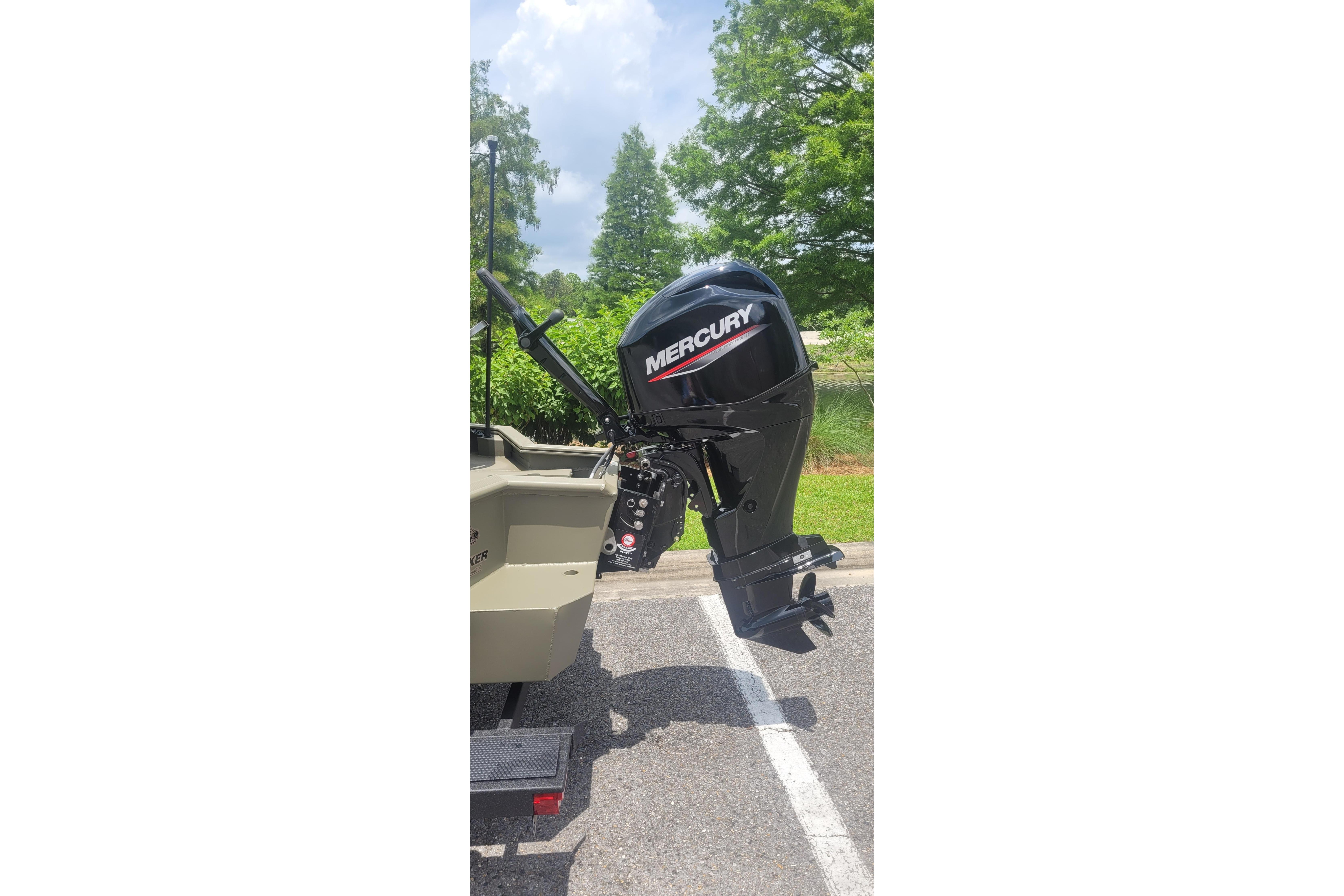 2026 Tracker Grizzly 1650 T Prairie Wings Edition with Mercury outboard motor in parking lot.