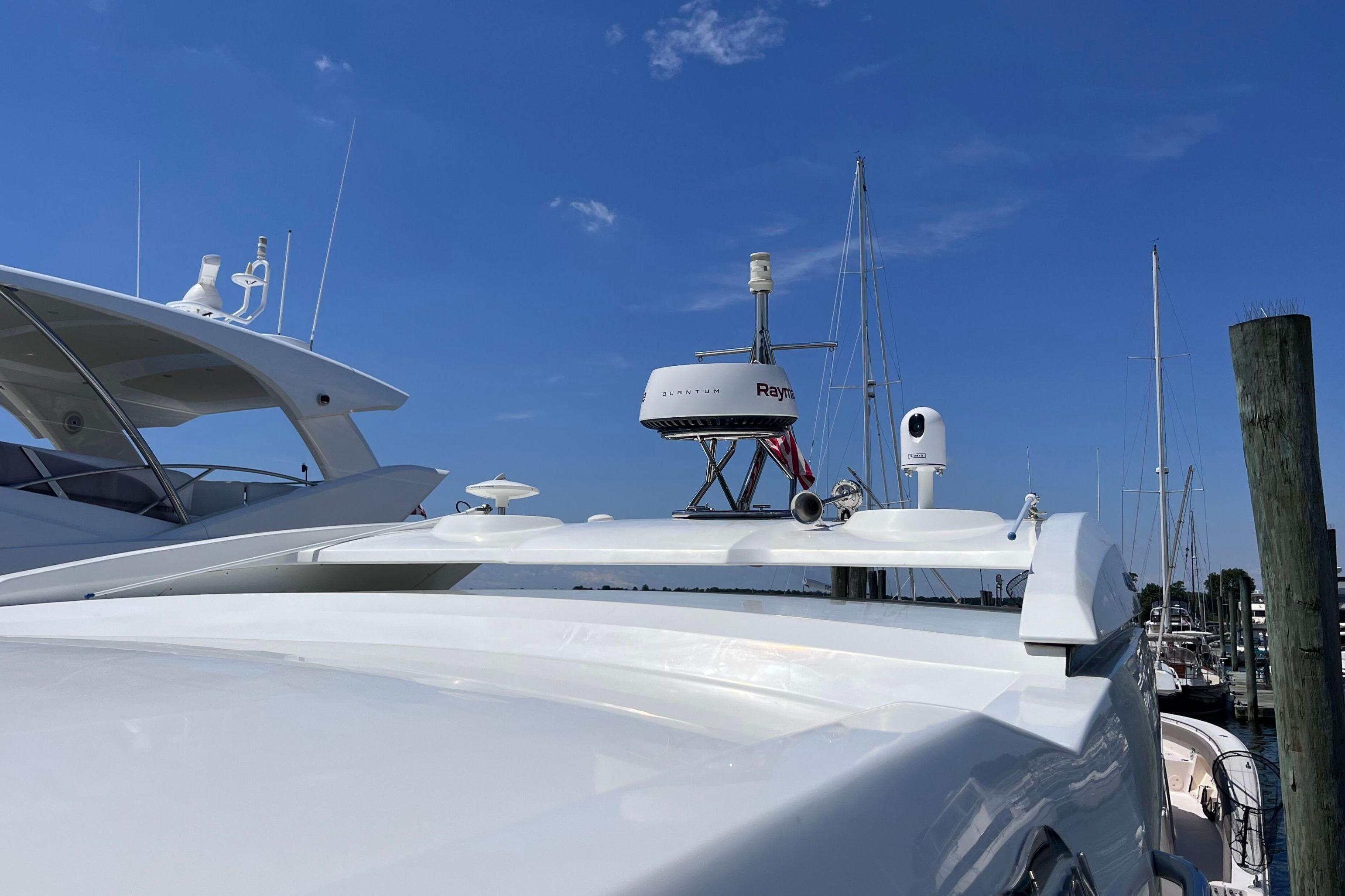 2024 Galeon 425 HTS yacht docked, featuring sleek design and advanced radar equipment.