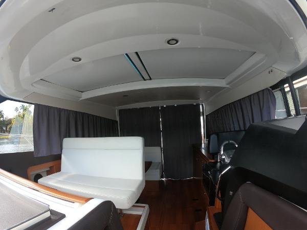 Interior of 2017 Jeanneau NC 11 boat with white seating and modern design.