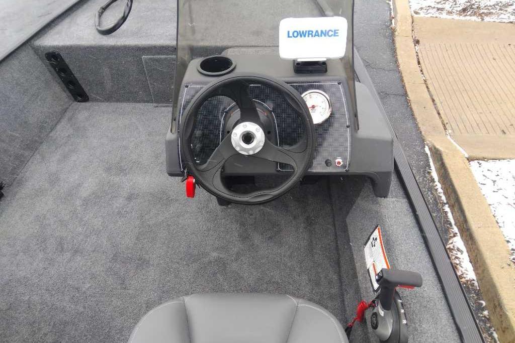 2026 Tracker Bass Tracker Classic XL boat cockpit with steering wheel and Lowrance display.