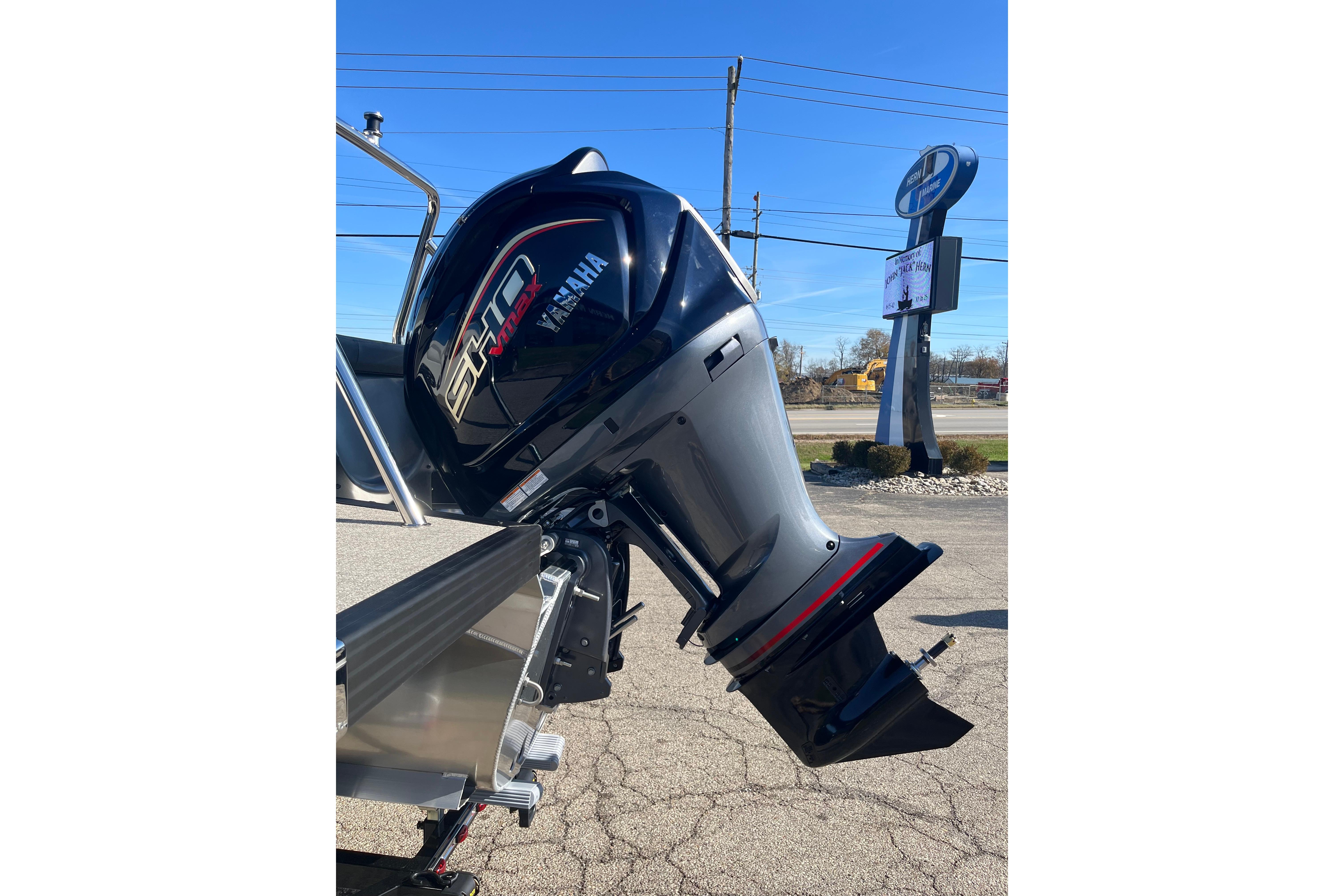 2026 Evotti 523CS boat with Yamaha VMAX outboard motor in a parking lot.
