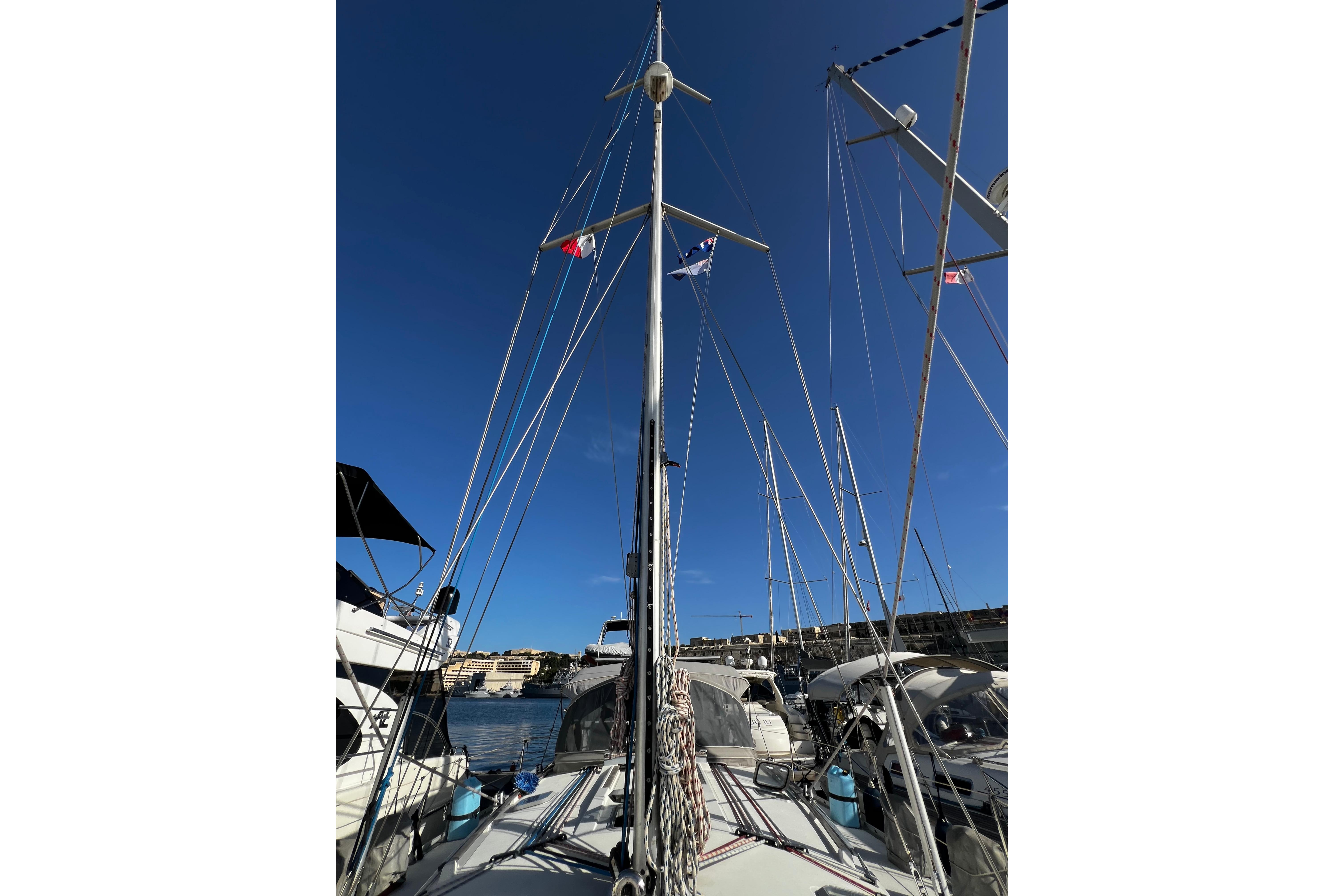 Sailboat Jeanneau Sun Odyssey 45.1, 1995 model, docked with mast and rigging visible.