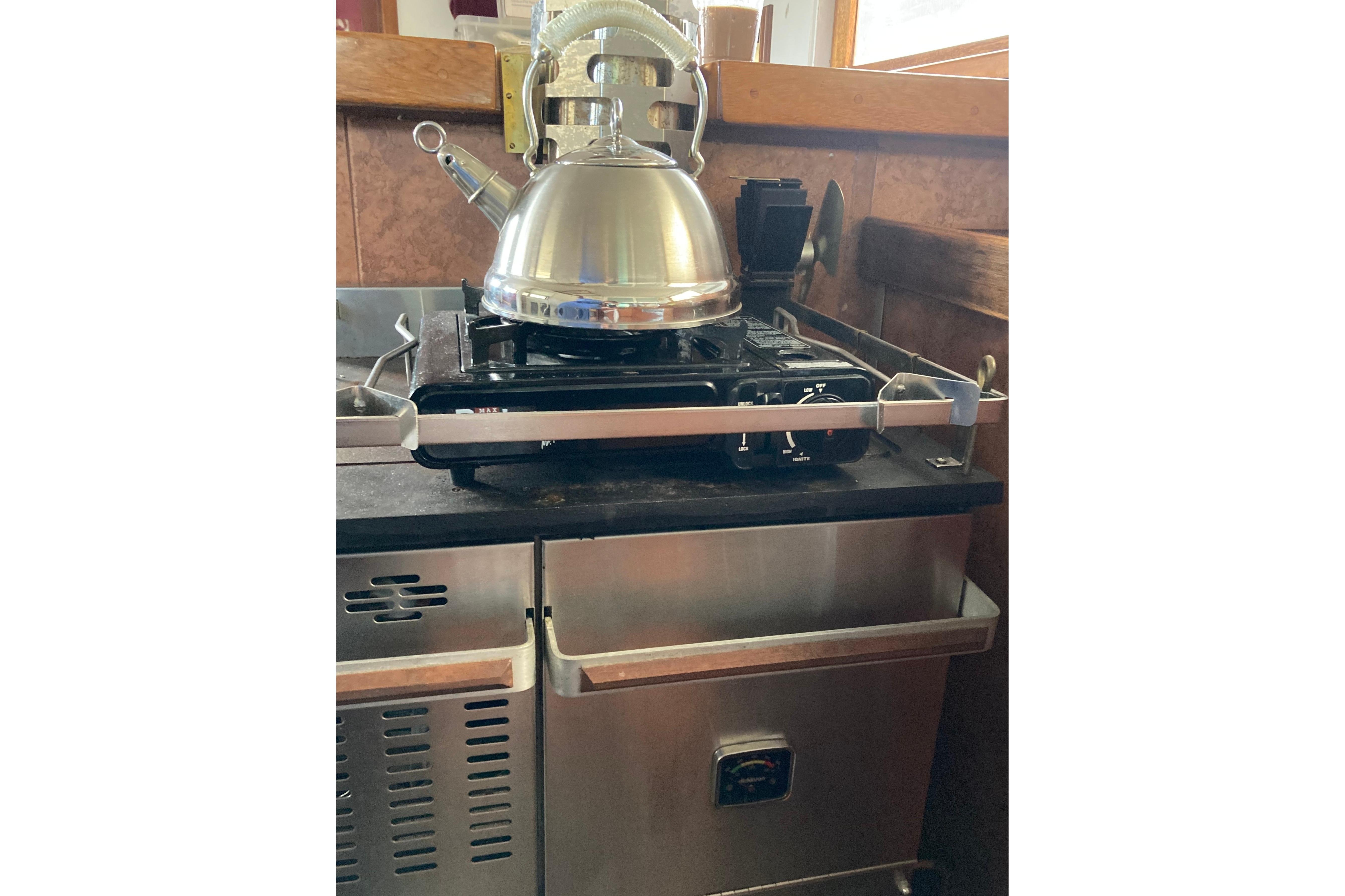 Stainless steel stove with kettle on Grenfell 42 Custom, 1942 model.