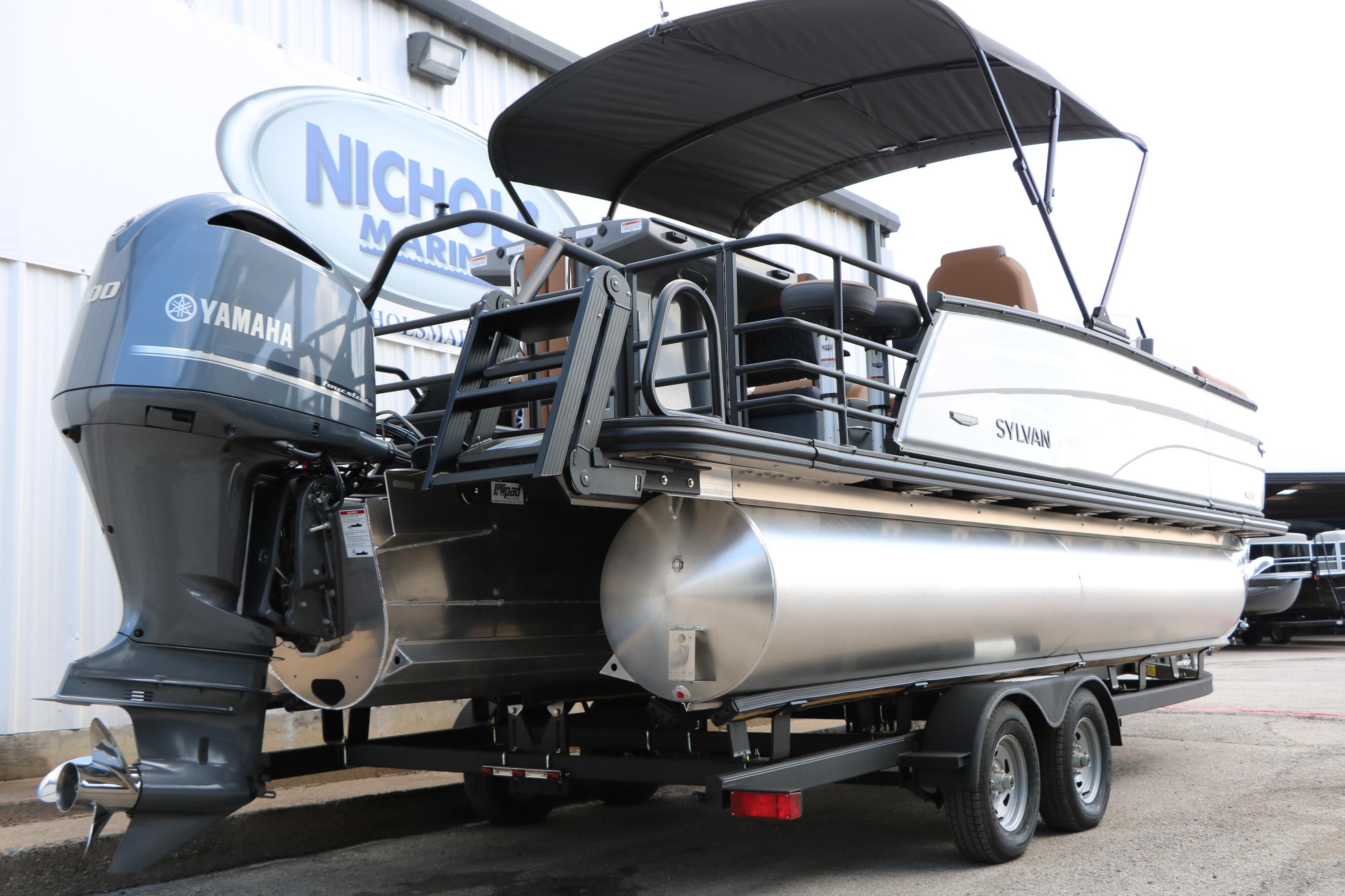 2026 Sylvan L3 DLZ Bar Platinum Edition Tri-Toon with Yamaha engine on trailer.