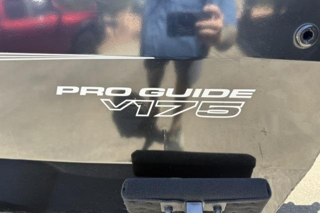 2026 Tracker Pro Guide V-175 WT boat logo on a reflective surface.
