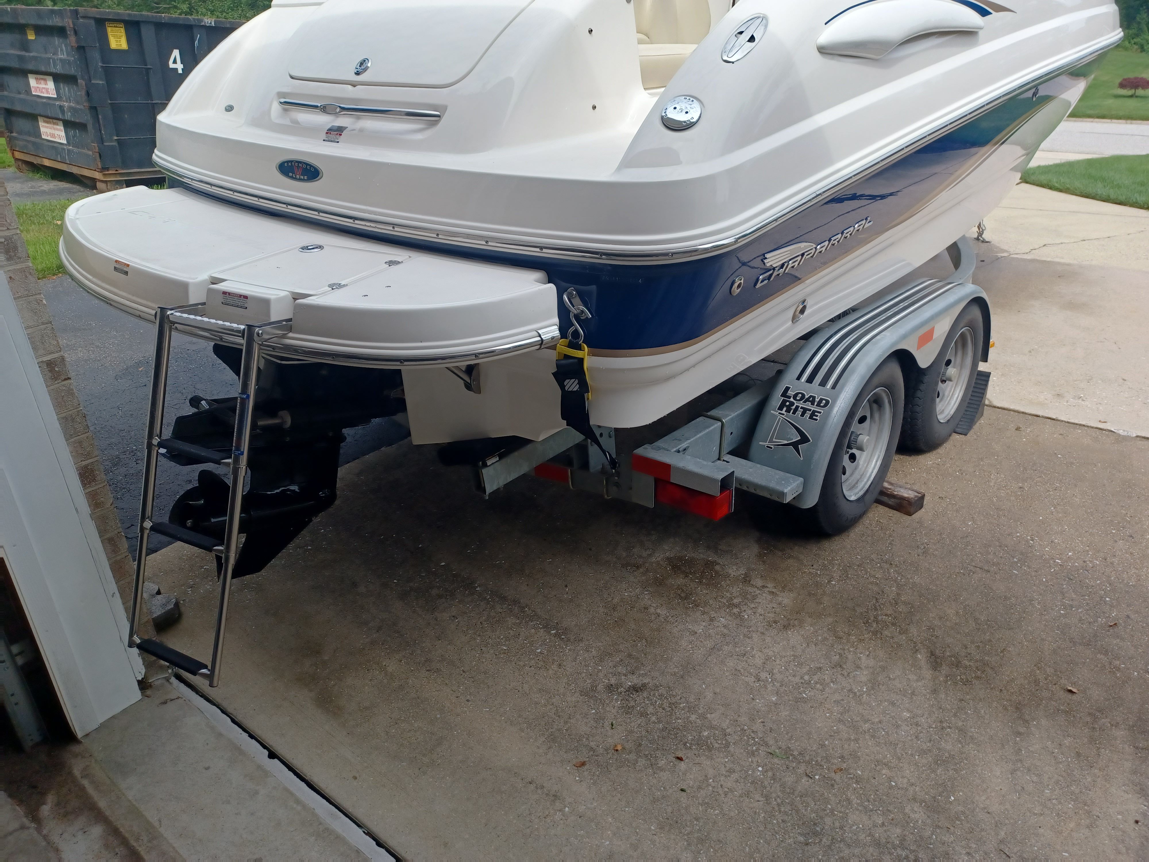 A 2004 Chaparral 215 SSi on a trailer with an extended swim platform and ladder.