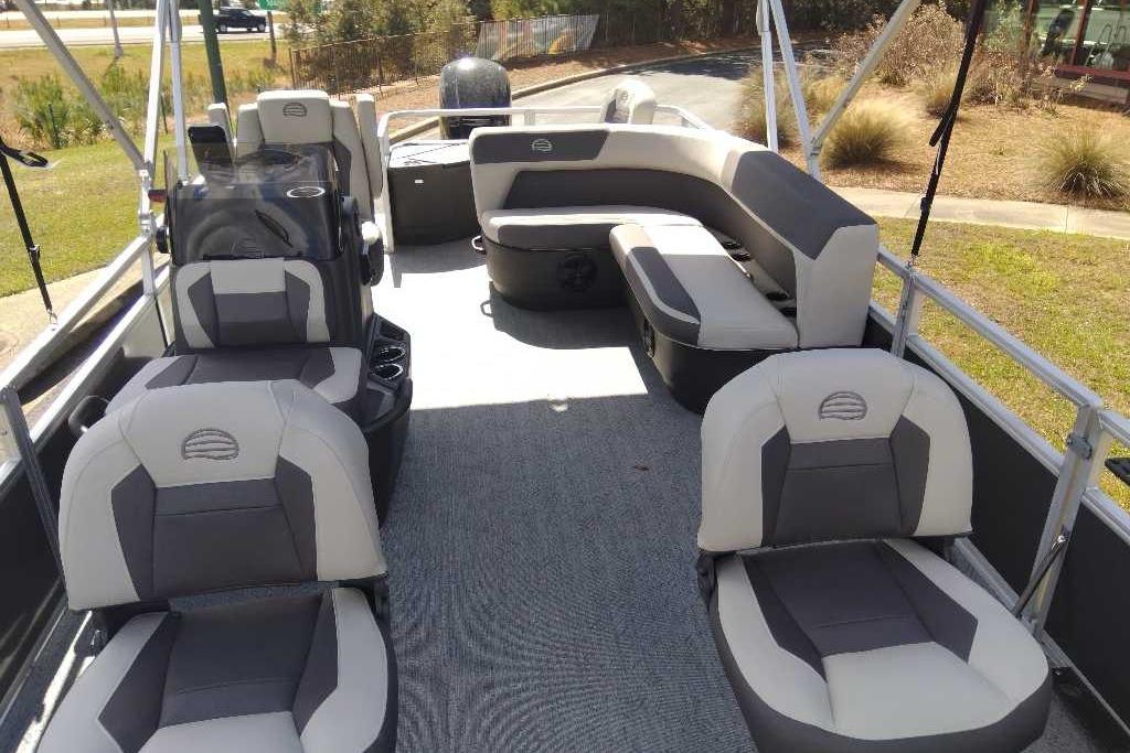2026 Sun Tracker Bass Buggy 18 DLX pontoon boat interior with seating and helm.