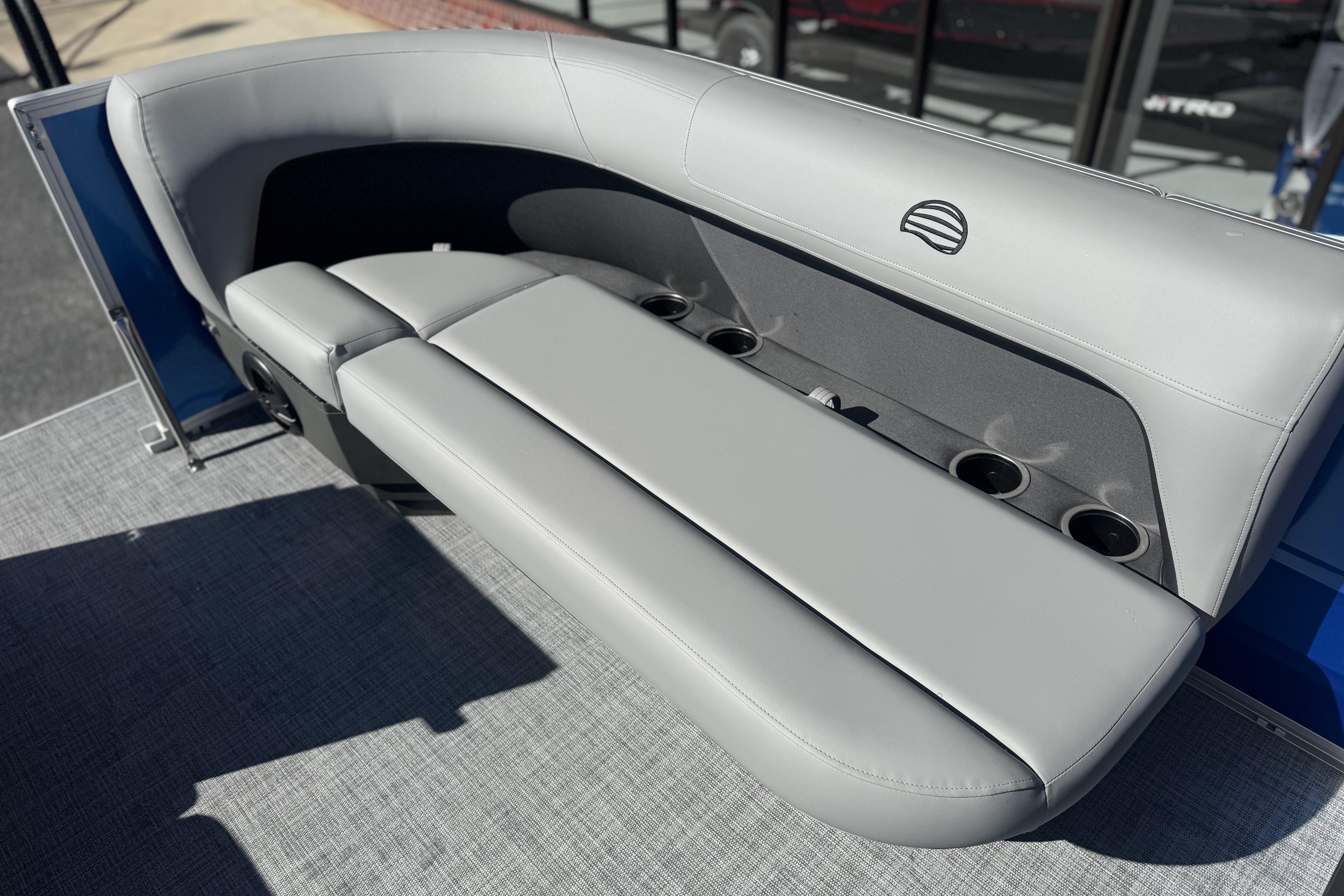 2026 Sun Tracker Party Barge 16 DLX pontoon boat with gray seating and cup holders.