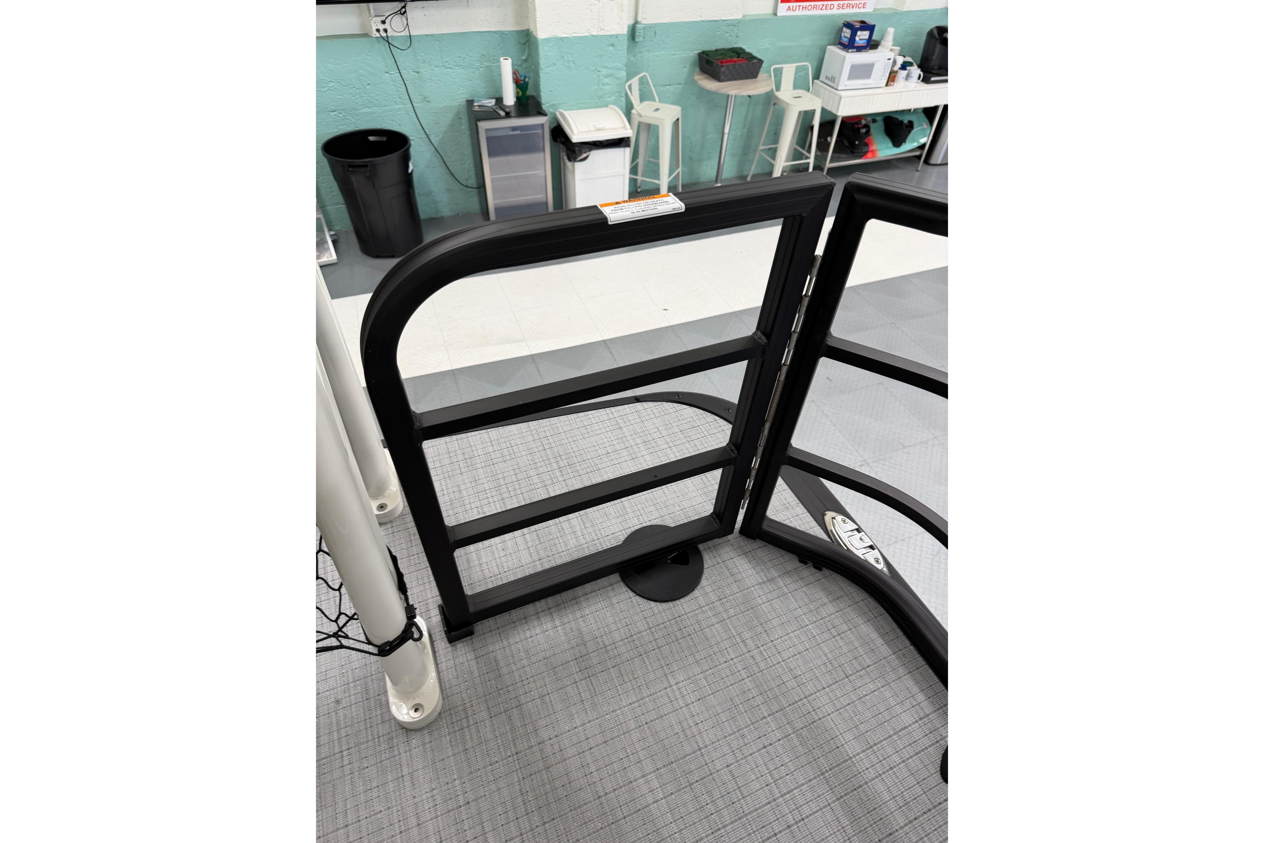 2026 South Bay 525SB2 boat gate in a showroom setting.